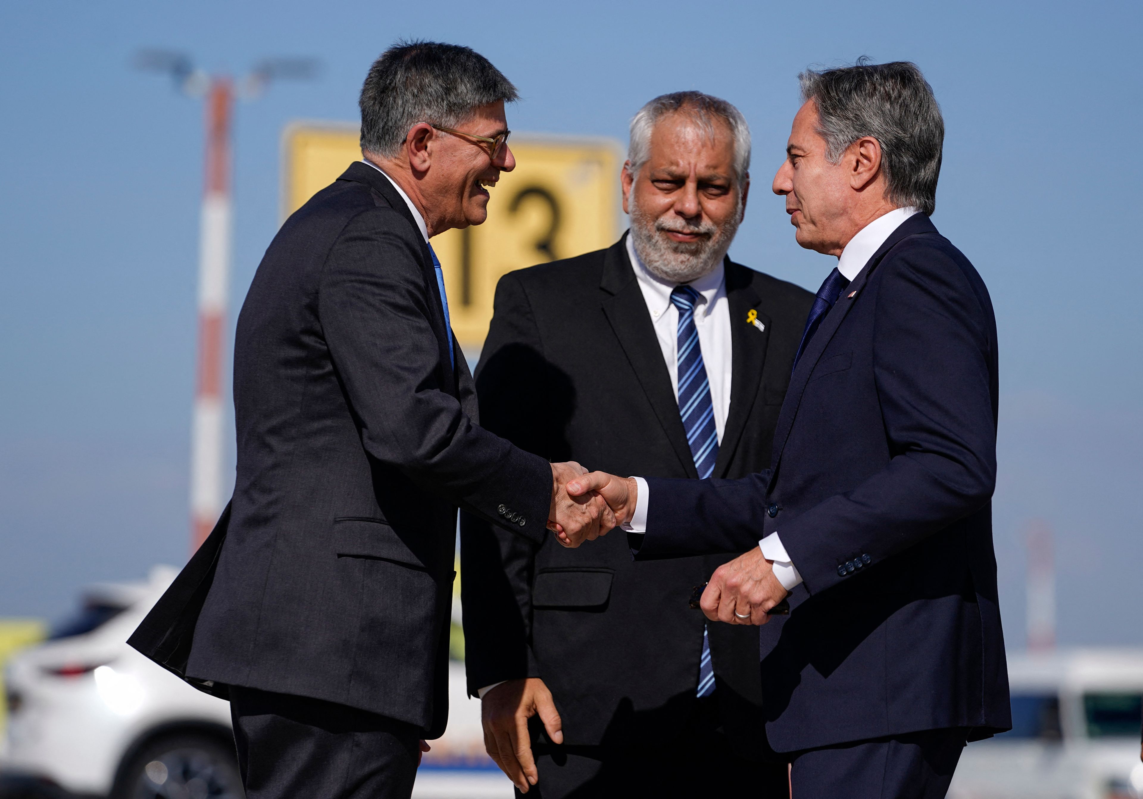 US Secretary of State Antony Blinken (R) is greeted by US Ambassador to Israel Jack Lew (L) and Israeli Ministry of Foreign Affairs Deputy Director General for North America Lior Hayat upon arrival at the Ben Gurion Airport in Tel Aviv on Oct. 22, 2024. US Secretary of State Antony Blinken landed on October 22 in Israel in a renewed push for a Gaza ceasefire, an AFP reporter travelling with him said, days after Israeli forces killed Hamas leader Yahya Sinwar. (Nathan Howard/Pool/AFP/Getty Images/TNS),