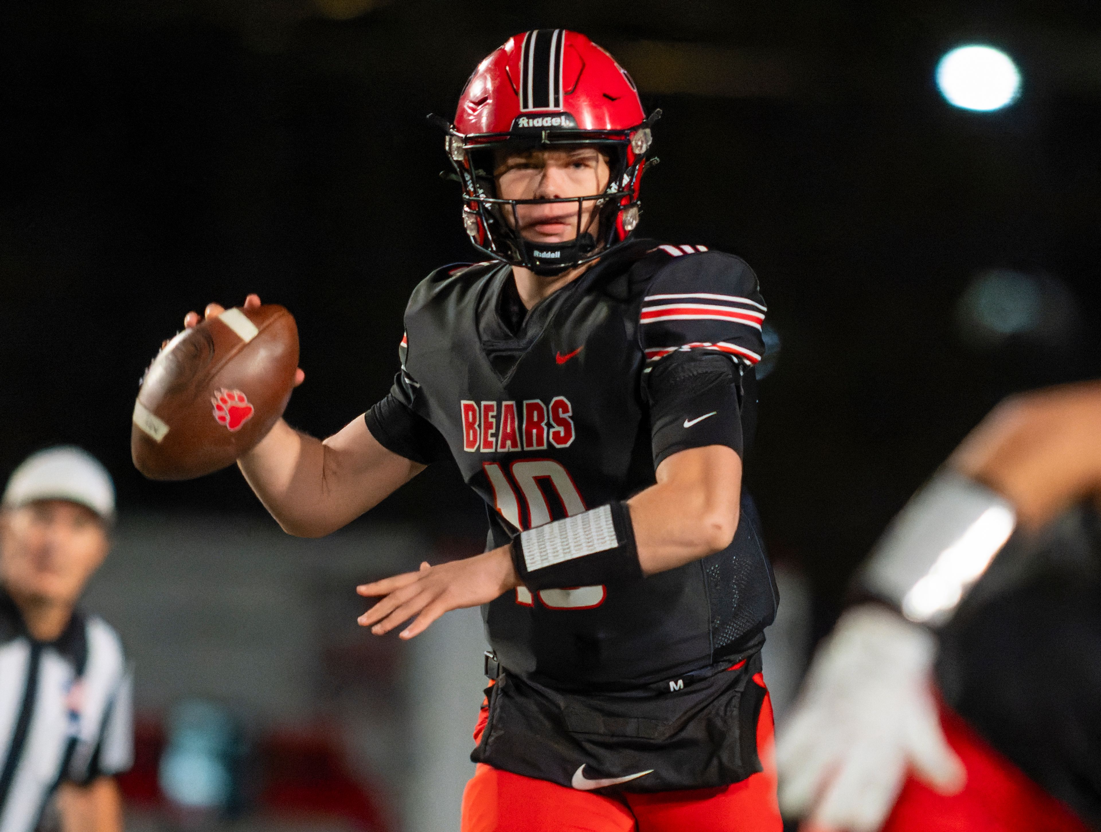 Moscow quarterback Noah Velasco looks to throw a pass during a game against the Bonners Ferry Badgers on Friday night at Bear Field in Moscow.