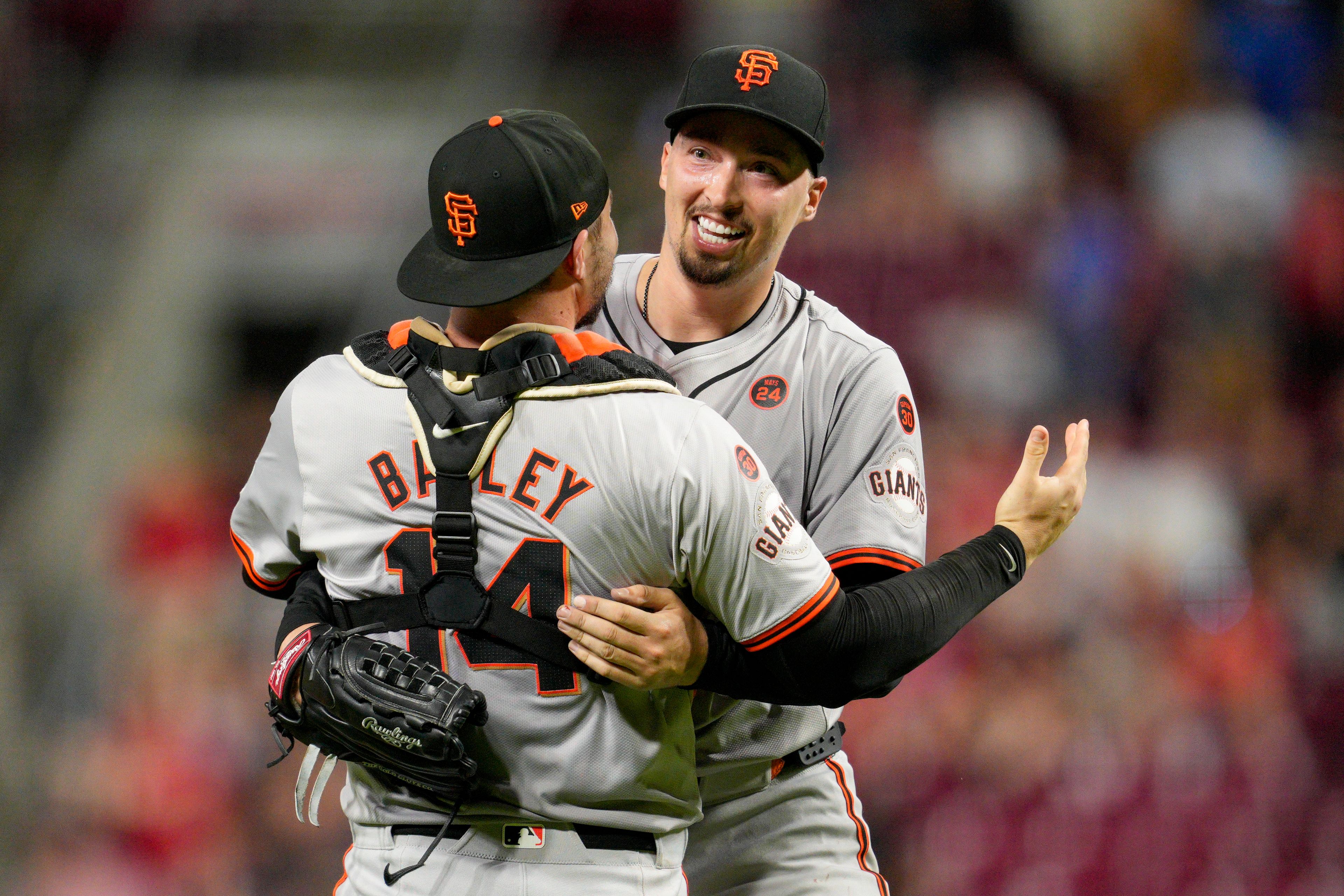 San Francisco Giants pitcher Blake Snell, right, celebrates with teammate Patrick Bailey (14) after throwing a no-hitter in nine complete innings of a baseball game against the Cincinnati Reds, Friday, Aug. 2, 2024, in Cincinnati. (AP Photo/Jeff Dean)