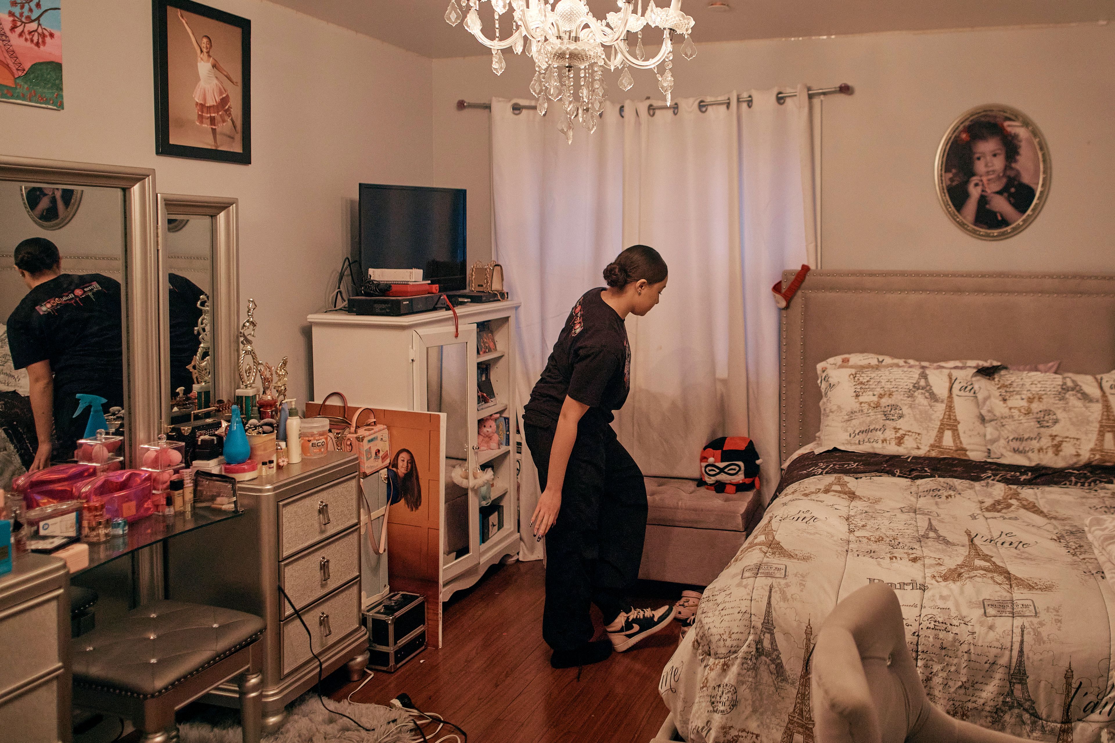 Gabriela Durham, 17, takes her shoes off inside her room on Saturday, Jan. 27, 2024, in New York. No longer just a distraction or a way to connect with friends, social media has matured into a physical space and a community that almost all U.S. teenagers belong to. Up to 95% of teenagers say they use social media, with more than one-third saying they are on it “almost constantly,” according to the Pew Research Center.