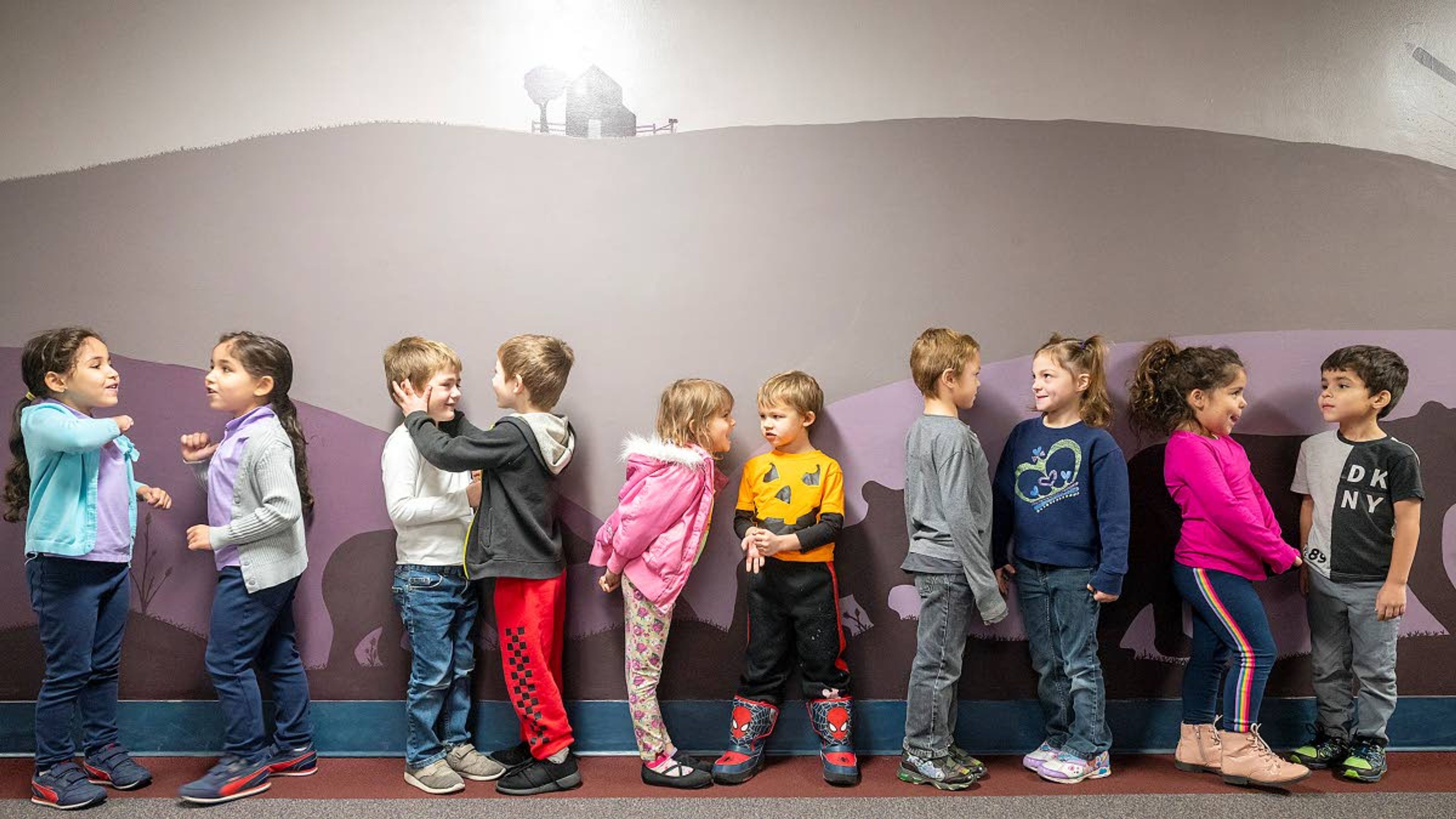 When prompted to figure out which twin is taller than the other, the five sets of twins enrolled in kindergarten at Grantham Elementary in Clarkston all had different reactions, other than one was sure they were taller than their sibling counterpart. Pictured from left: Rayan El hassadi, Roaa El hassadi, Jaxon Raney, Karson Raney, Ayanna Schilt, Ayble Schilt, Nicholas May, Nikole May, Naomi Shawer and Noah Shawer.