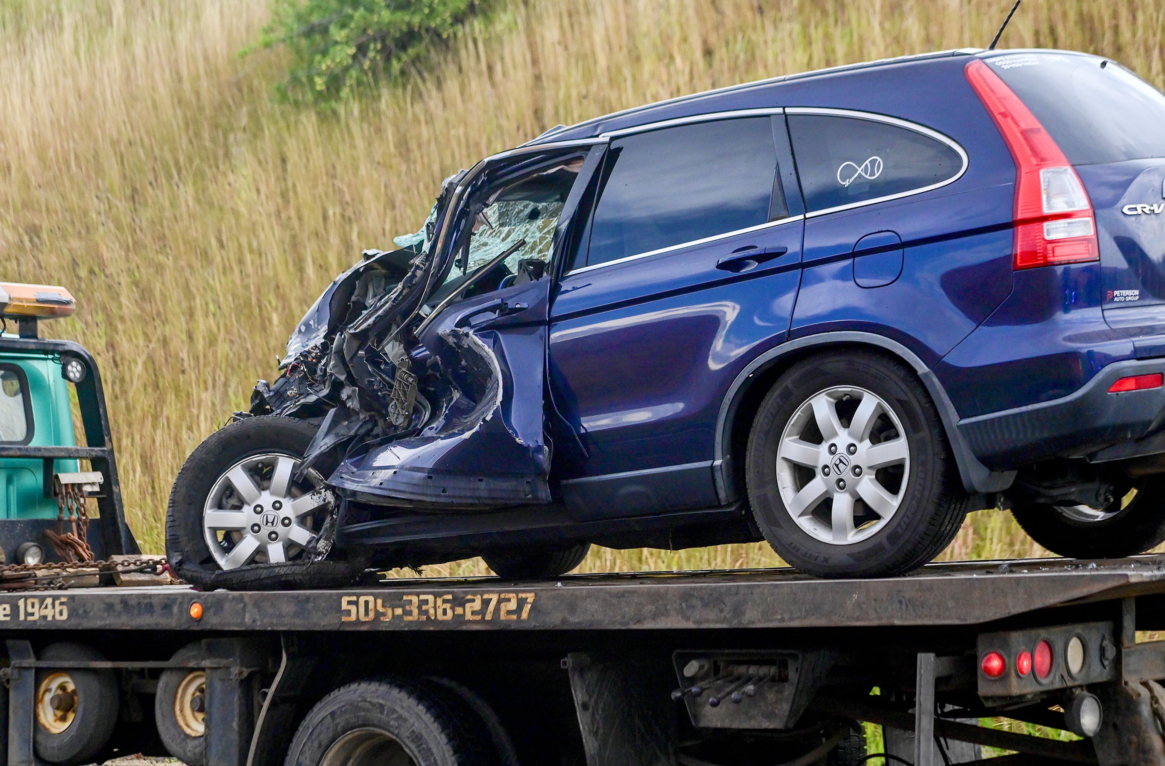 A car involved in a crash along U.S. Highway 95 south of Moscow on Monday is driven away from the site of the accident near milepost 342.