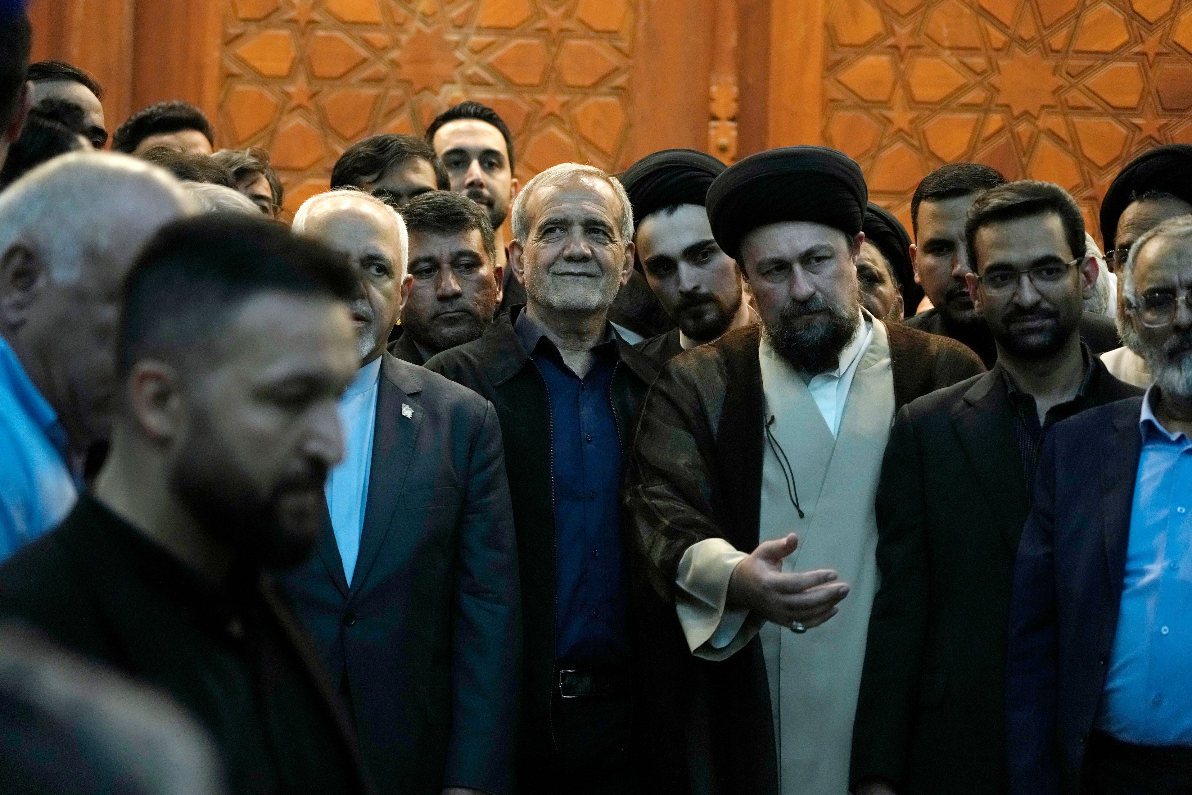 Iran's President-elect Masoud Pezeshkian, center, arrives to attend a meeting a day after the presidential election, at the shrine of the late revolutionary founder Ayatollah Khomeini, just outside Tehran, Iran, Saturday, July 6, 2024. (AP Photo/Vahid Salemi)