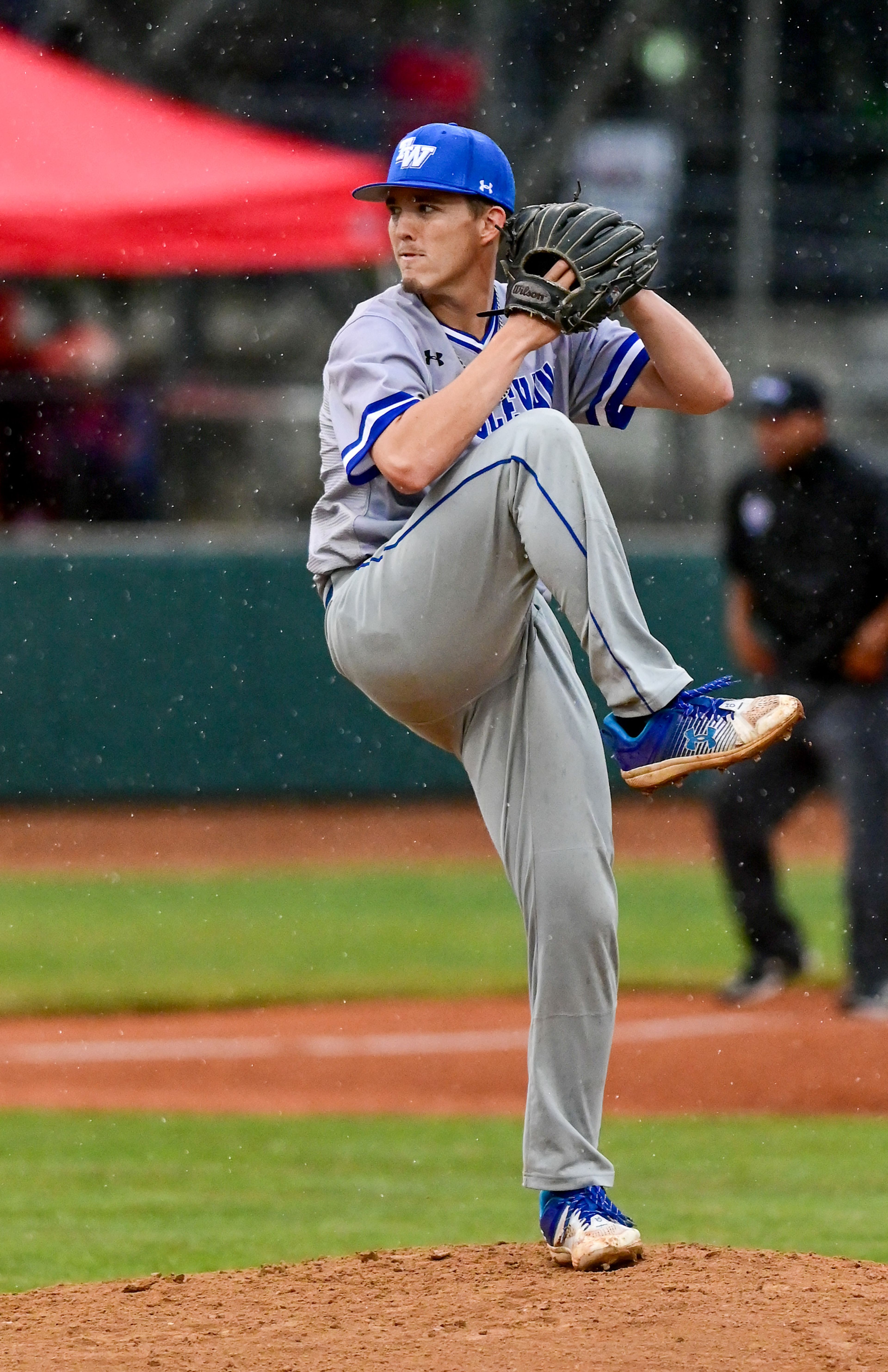 Tennessee Wesleyan pitcher Blake Peyton prepares to throw a pitch in the rain against Cumberlands on the opening day of the NAIA World Series at Harris Field in Lewiston on Friday.