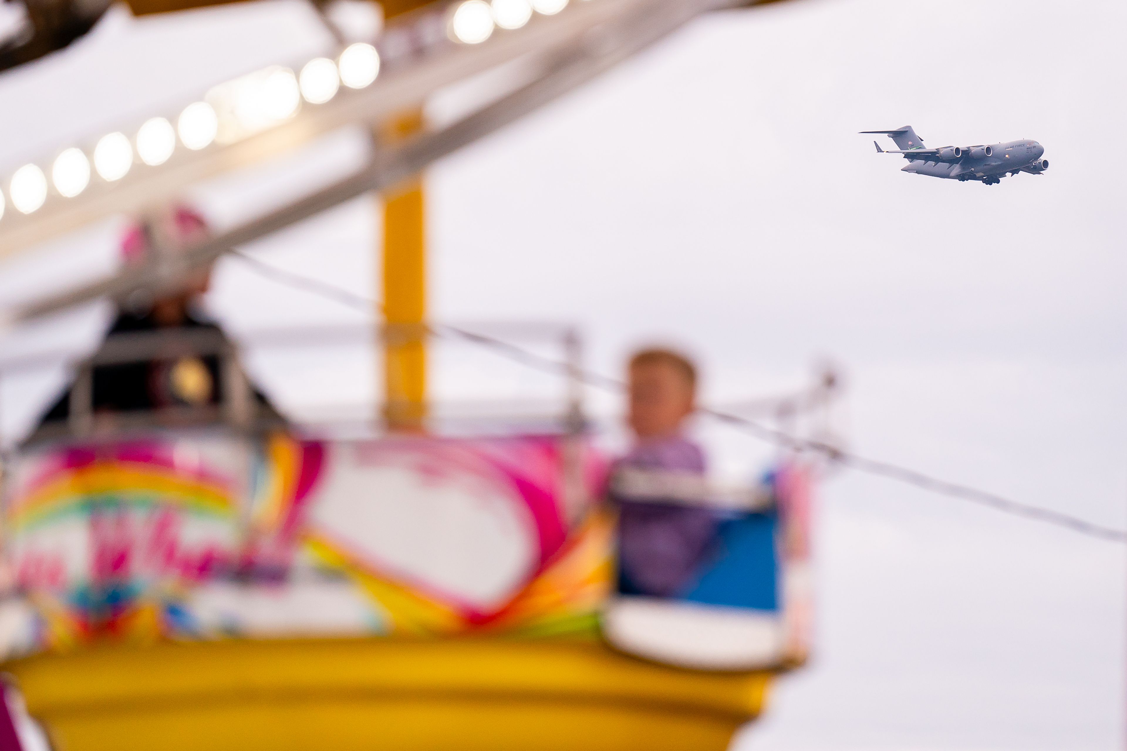 A C-17 military jet flys over the Nez Perce County Fair on Friday night in Lewiston.