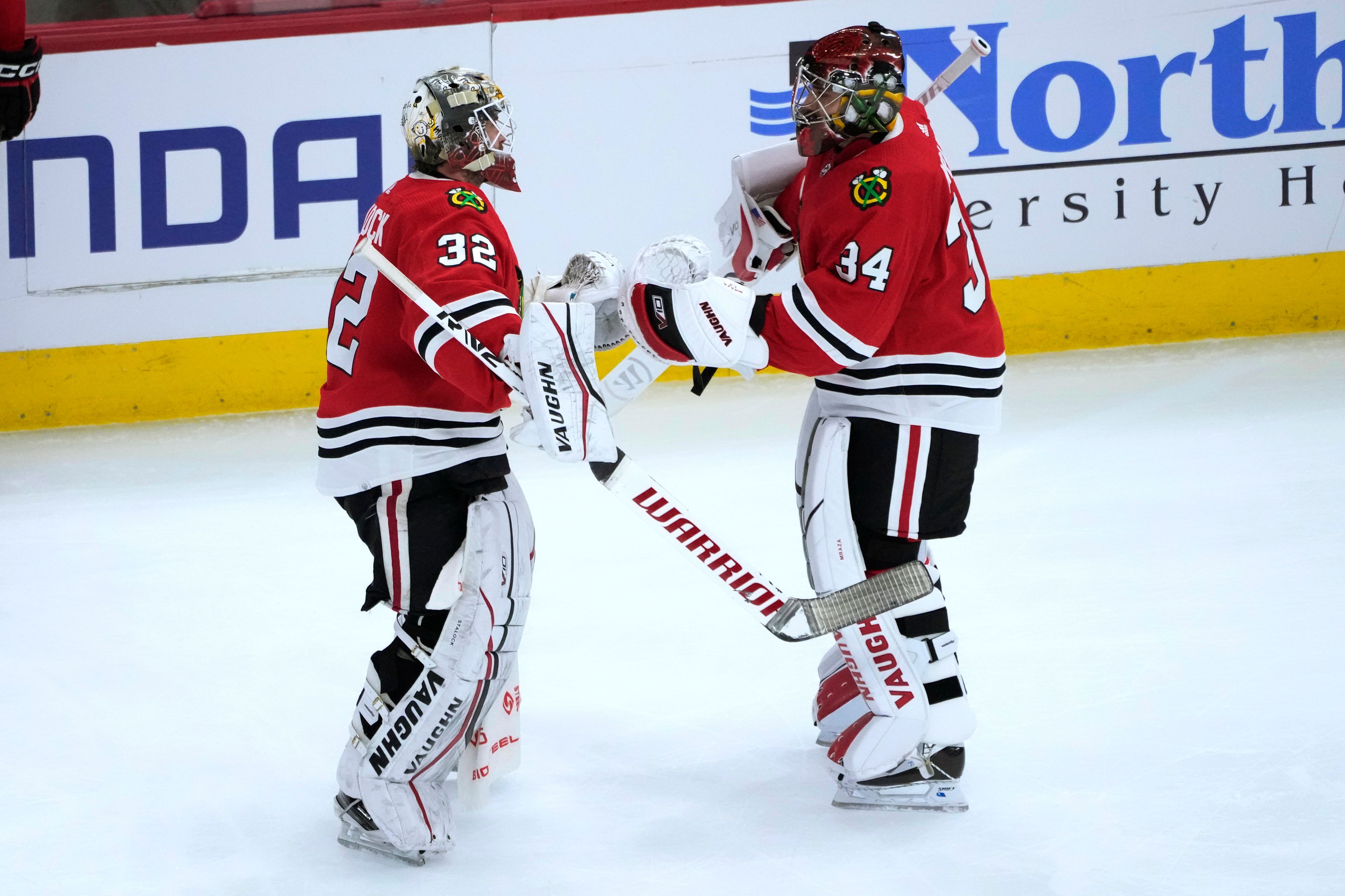 Chicago Blackhawks goaltender Alex Stalock (32) replaces goaltender Petr Mrazek after the Seattle Kraken scored for the fourth time against Mrazek during the first period of an NHL hockey game Saturday, Jan. 14, 2023, in Chicago. (AP Photo/Charles Rex Arbogast)