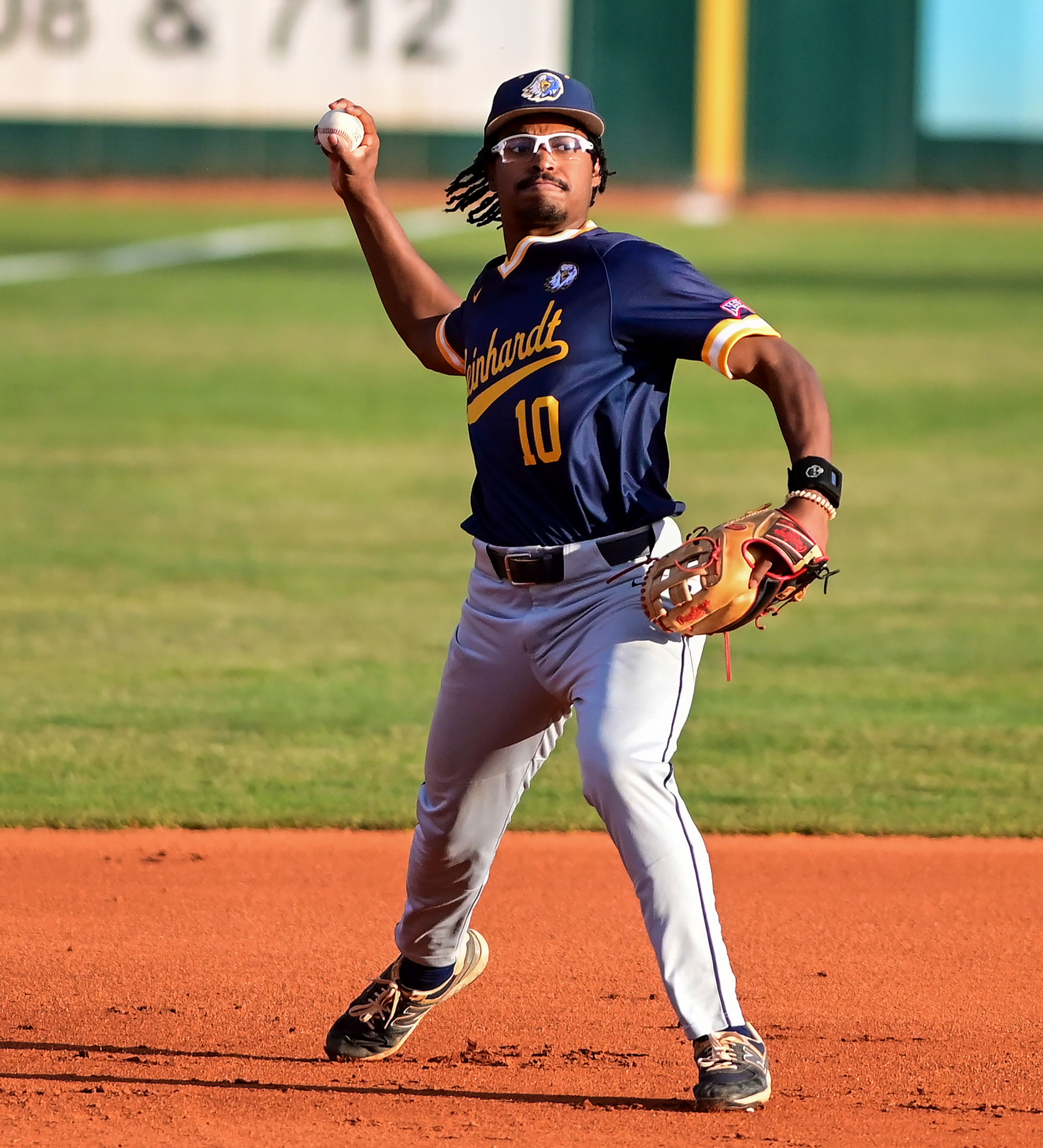 Reinhardt infielder Jarrett Burney passes to first base after picking up a ground ball from Tennessee Wesleyan in Game 18 of the NAIA World Series at Harris Field in Lewiston on Thursday.