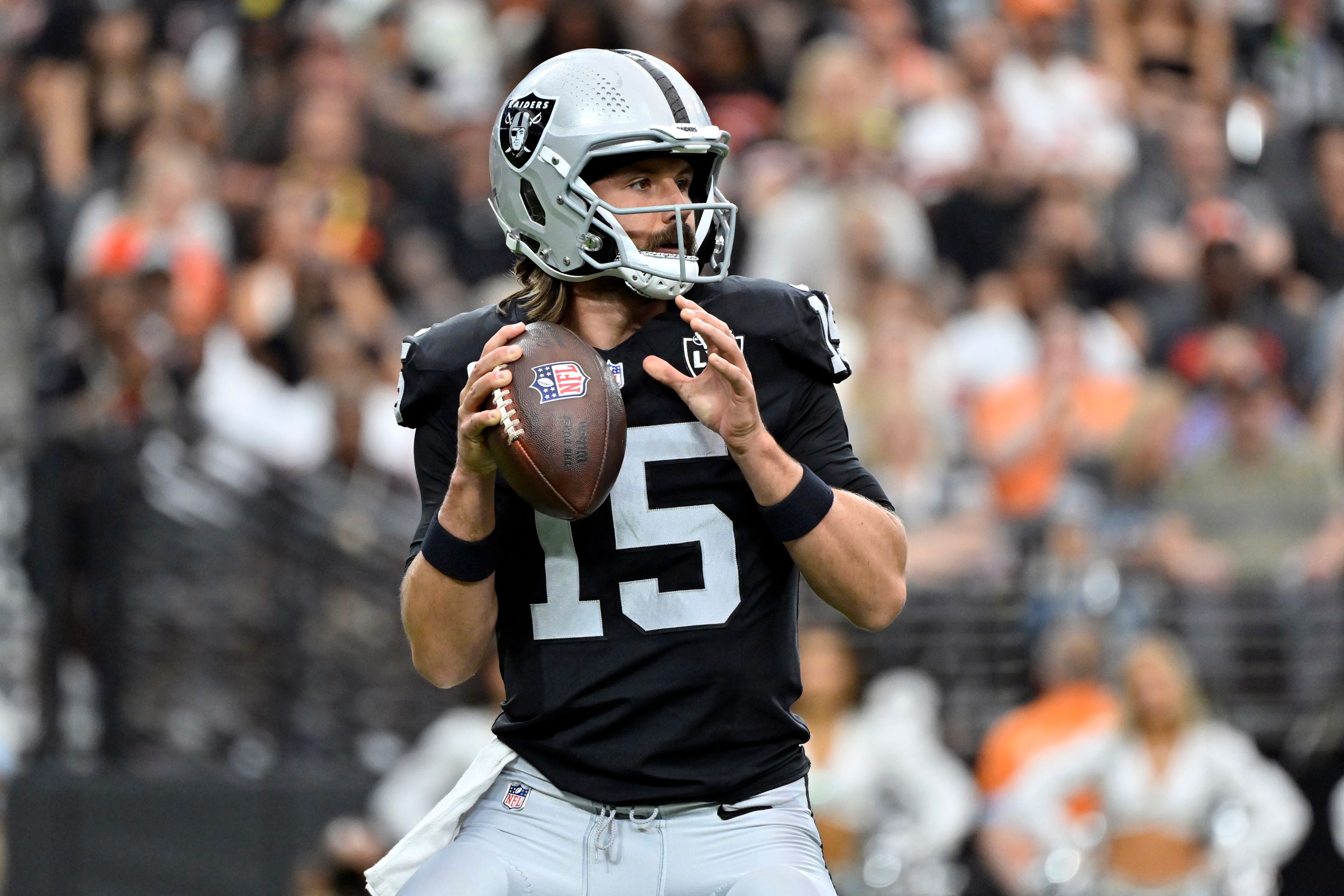 Las Vegas Raiders quarterback Gardner Minshew (15) looks to pass against the Cleveland Browns during an NFL football game, Sunday, Sept. 29, 2024, in Las Vegas. (AP Photo/David Becker)