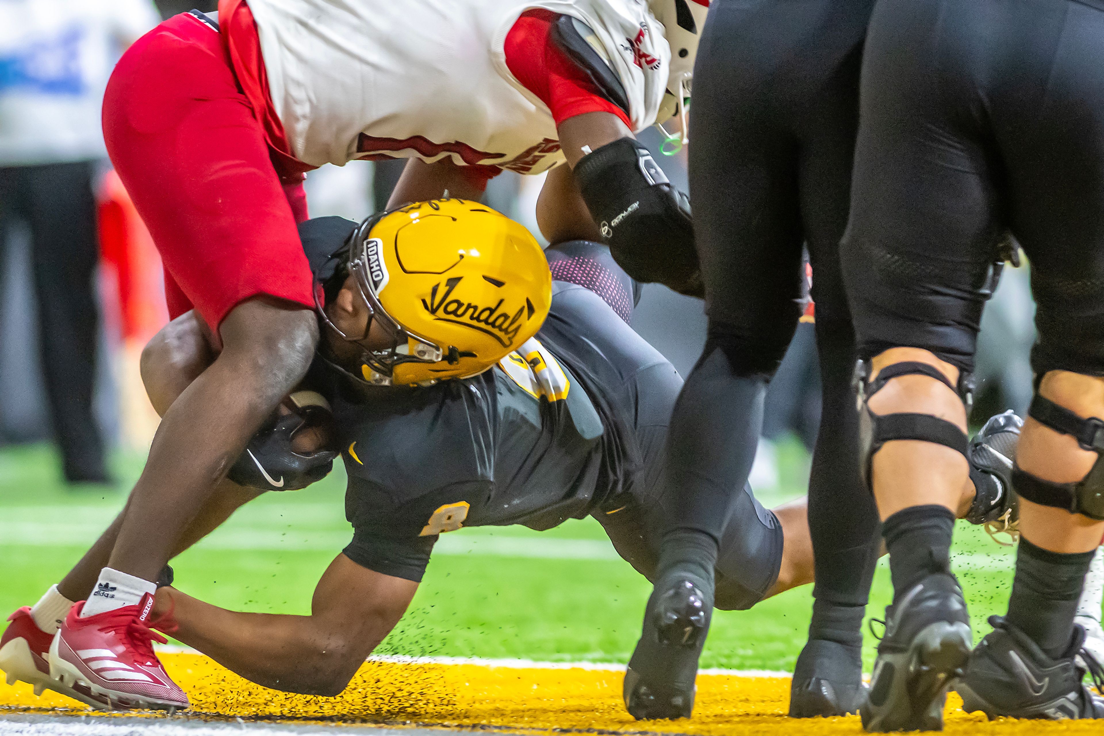 Idaho running back Deshaun Buchanan gets across the end zone for a touchdown against Eastern Washington during a Big Sky game Saturday at the Kibbie Dome in Moscow. ,