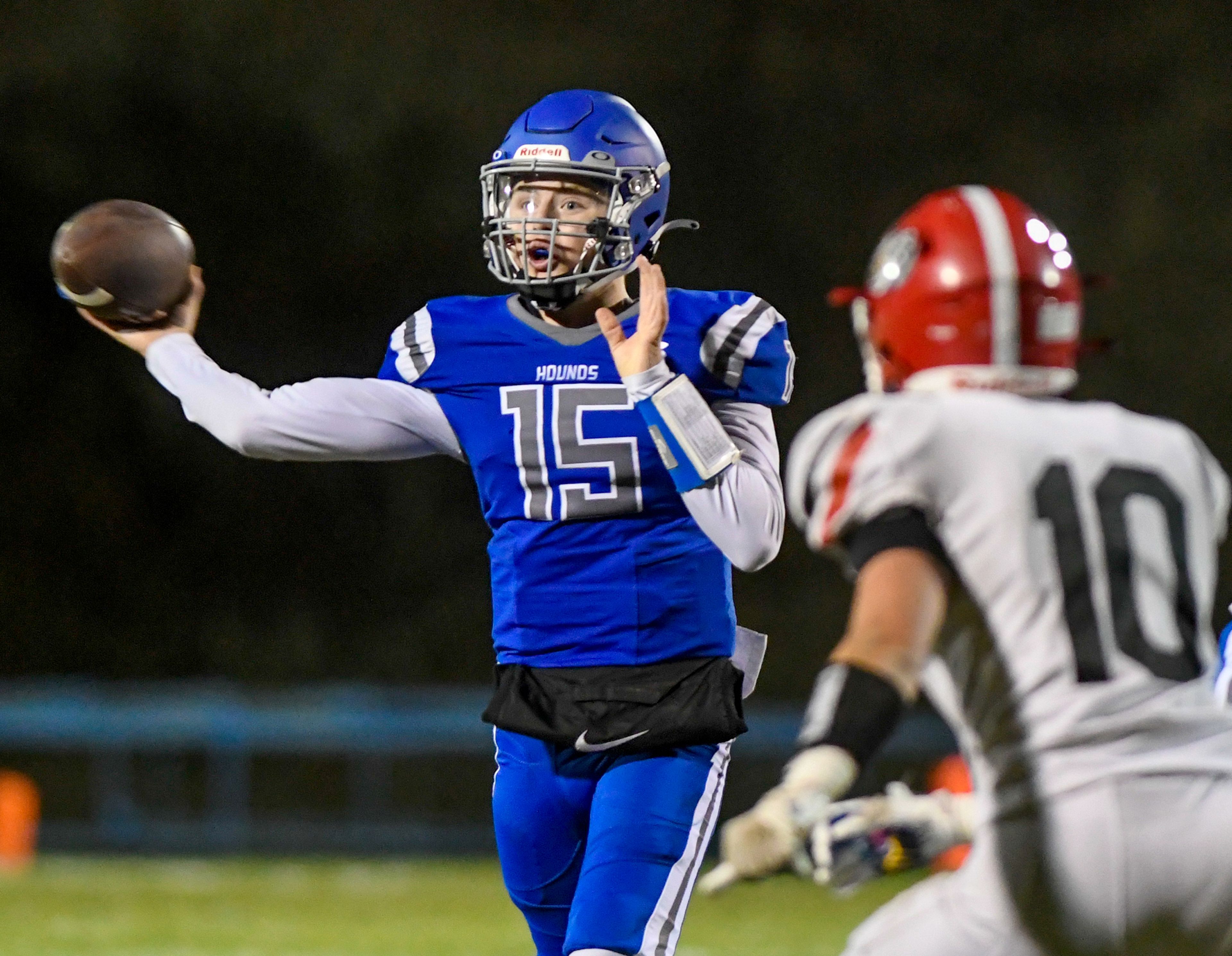 Pullmans Connor Stewart throws the ball with pressure from Clarkston defenders Friday in Pullman.,