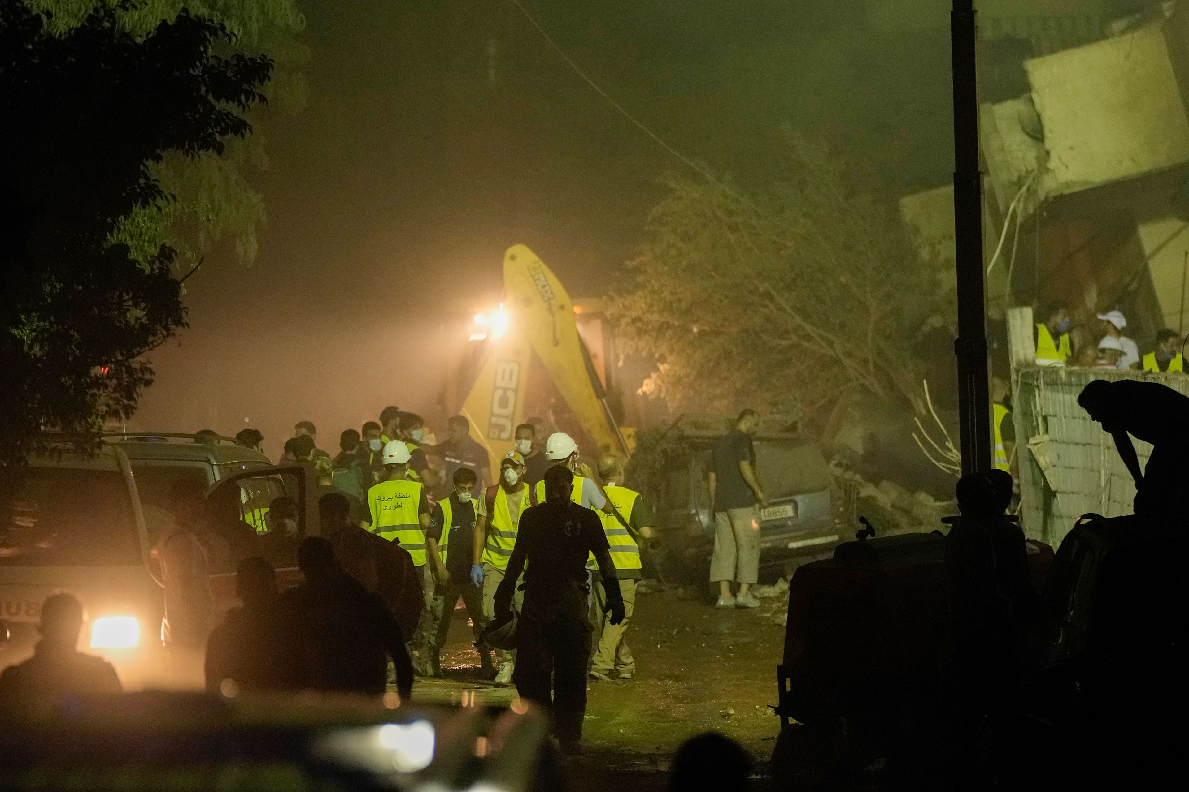 Rescuers arrive at the site of an Israeli airstrike in Beirut's southern suburbs Friday, Sept. 27, 2024. (AP Photo/Bilal Hussein)