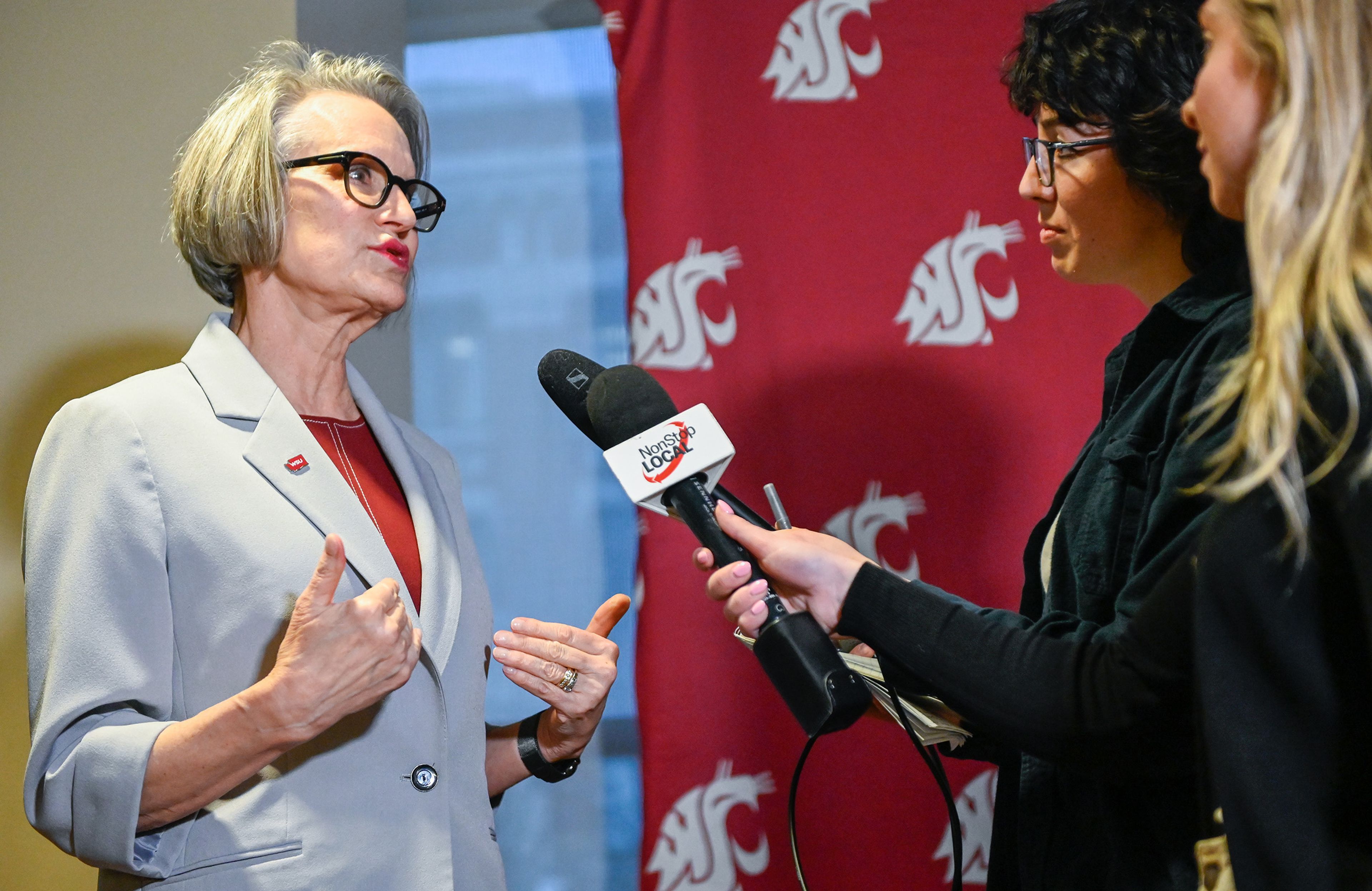 Newly appointed Washington State University president Elizabeth “Betsy” Cantwell, left, answers media questions Thursday after a regents meeting in Pullman.