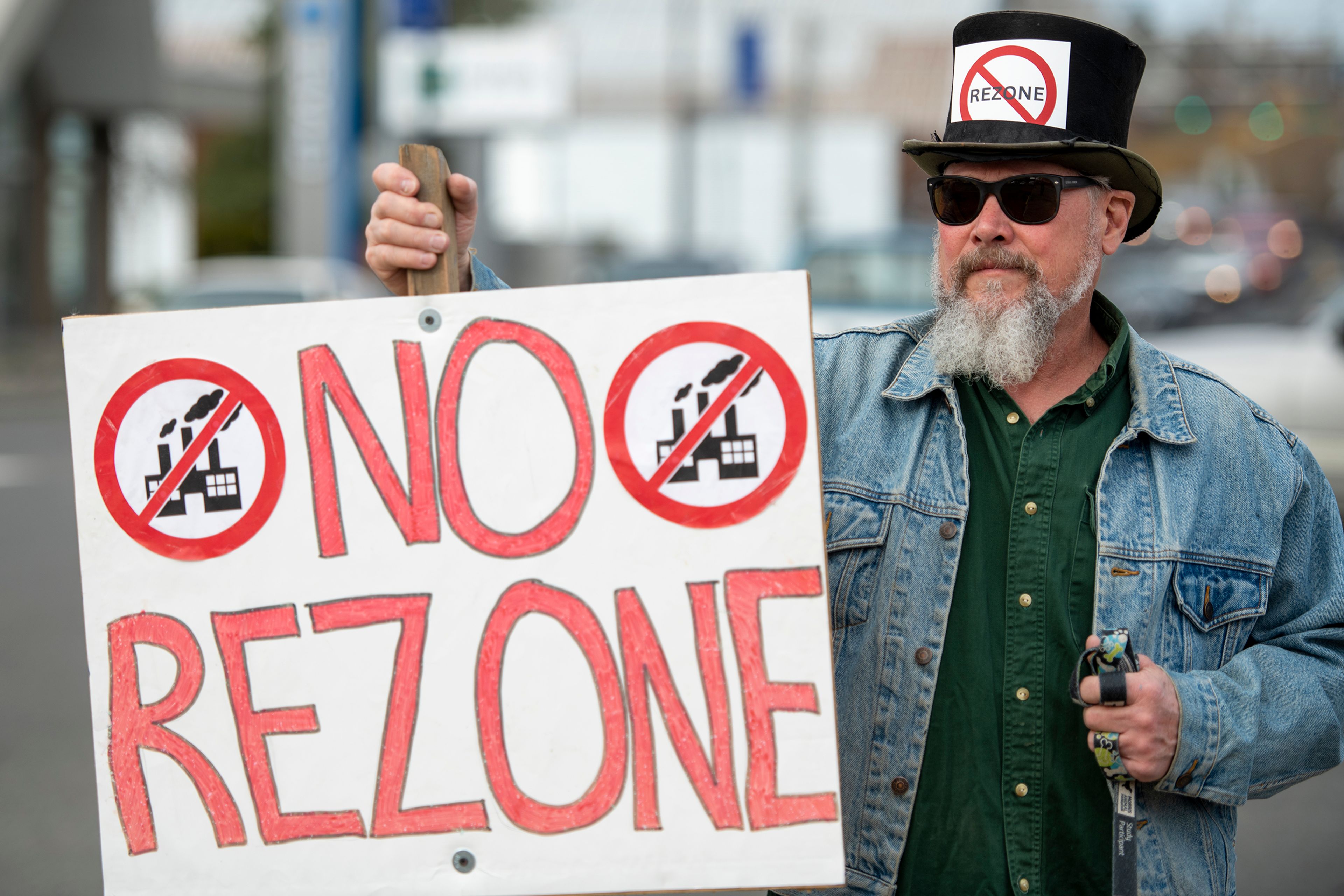 Bill Owens participates in a protest Monday against the Port of Whitman’s decision to rezone on a residential property next to Whispering Hills neighborhood in Pullman.