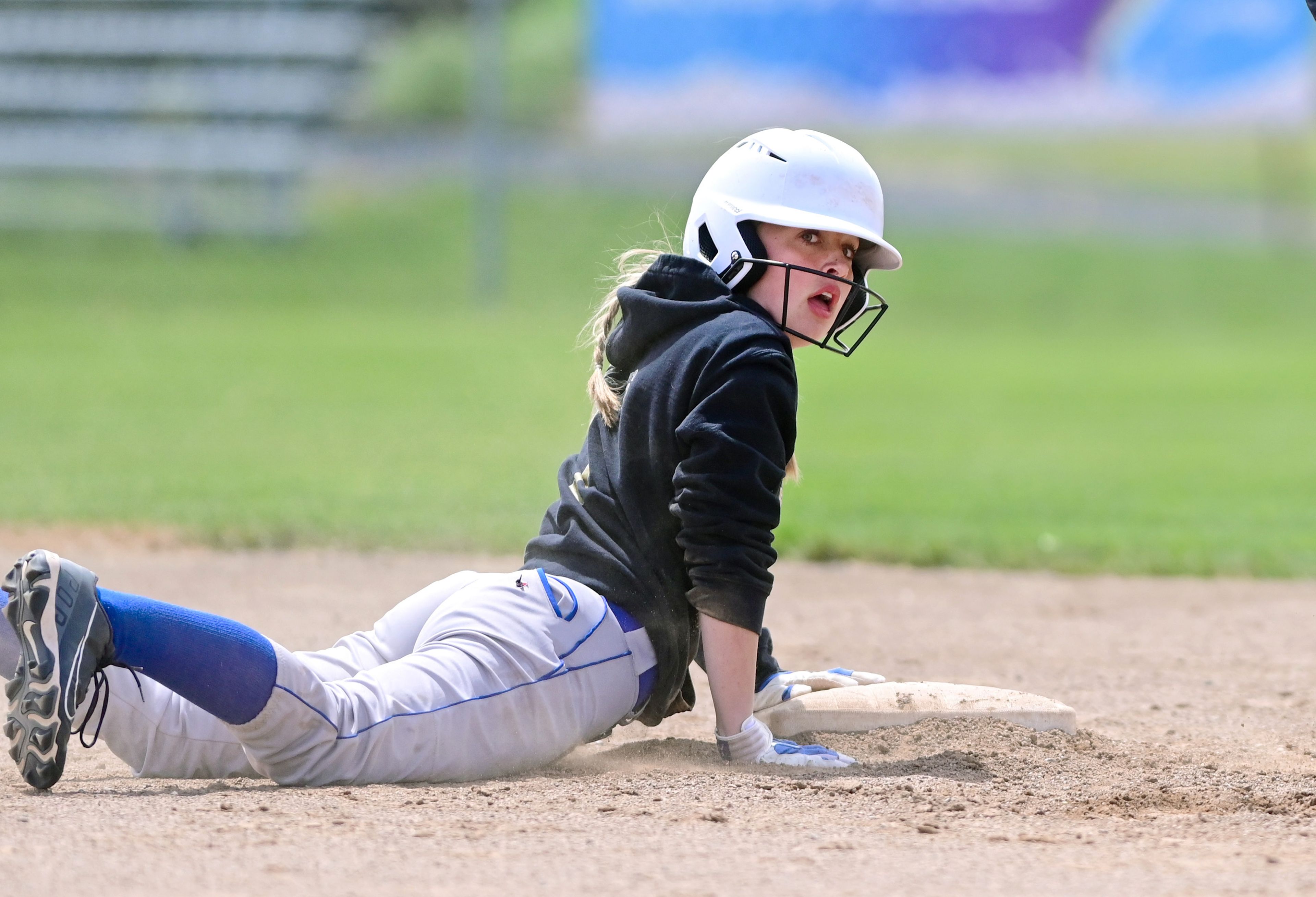 Genesee’s Sydney Banks slides to tag up on second base during an Idaho Class 1A state championship game Friday in Genesee.