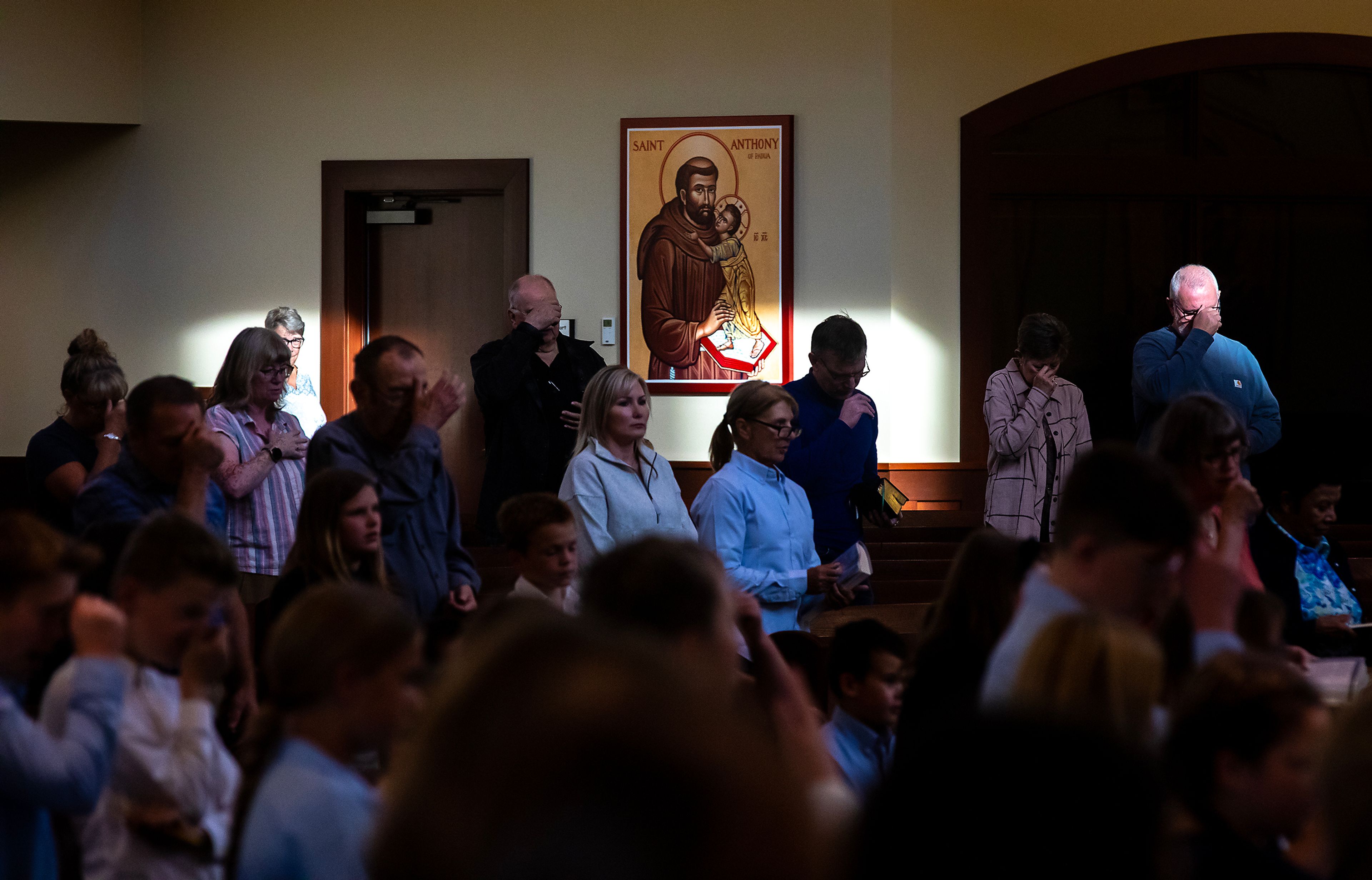 Parishioners attend Mass on Wednesday at All Saints Catholic Church in the Lewiston Orchards.