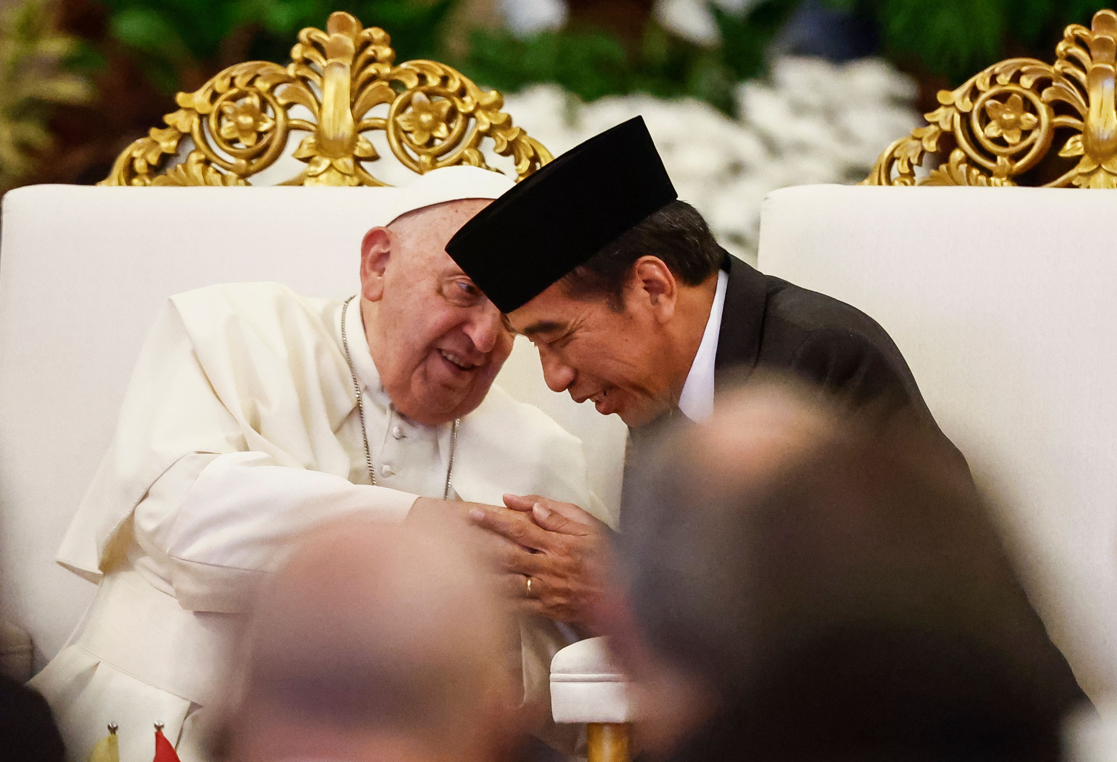 Pope Francis, left, and Indonesian President Joko Widodo attend a meeting with Indonesian authorities, civil society and the diplomatic corps, during his apostolic visit to Asia, at the Presidential Palace in Jakarta Wednesday, Sept. 4, 2024.