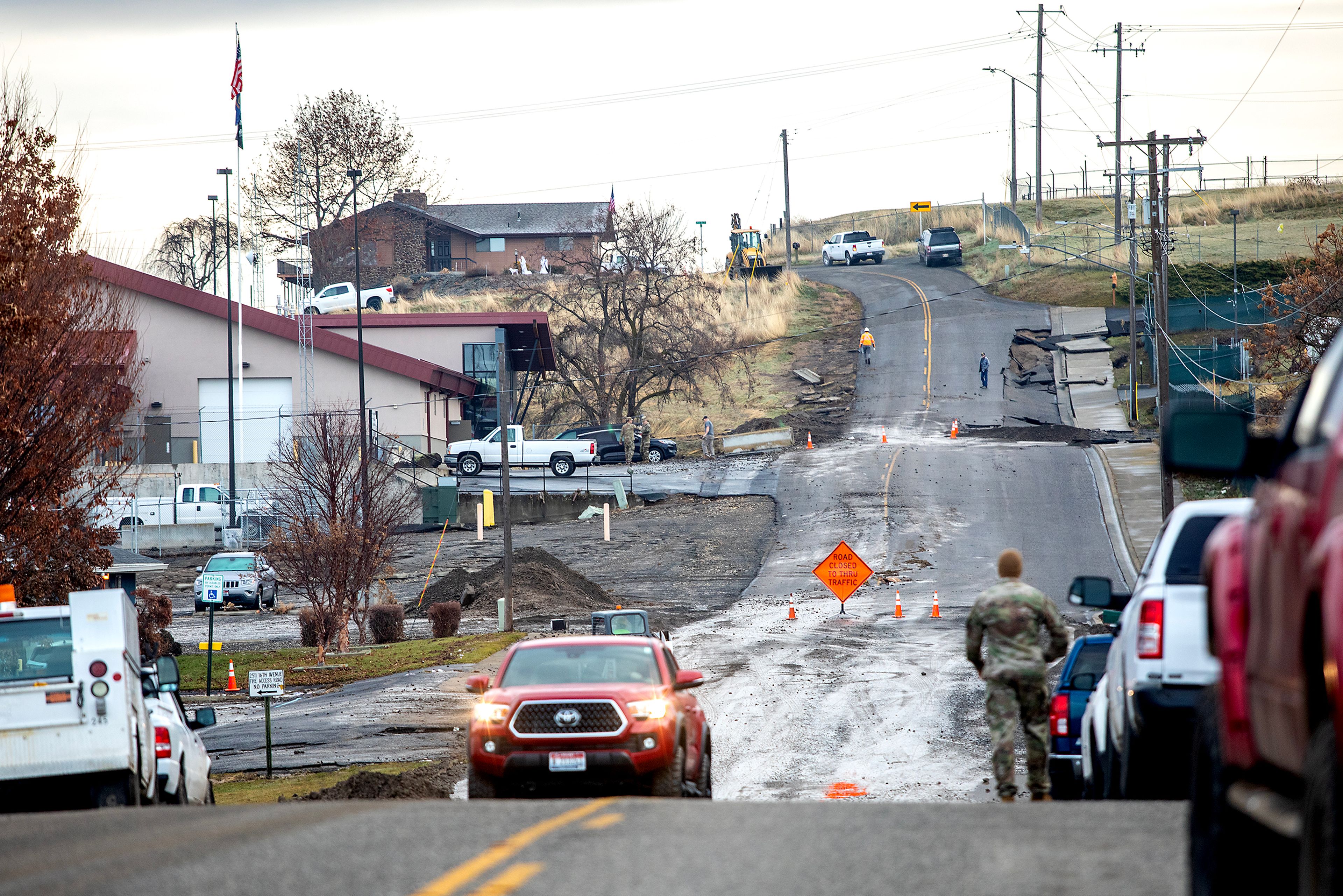 16th Avenue sits closed after a water reservoir at the corner of 16th Avenue and 29th Street burst in the early hours of Wednesday morning in Lewiston.