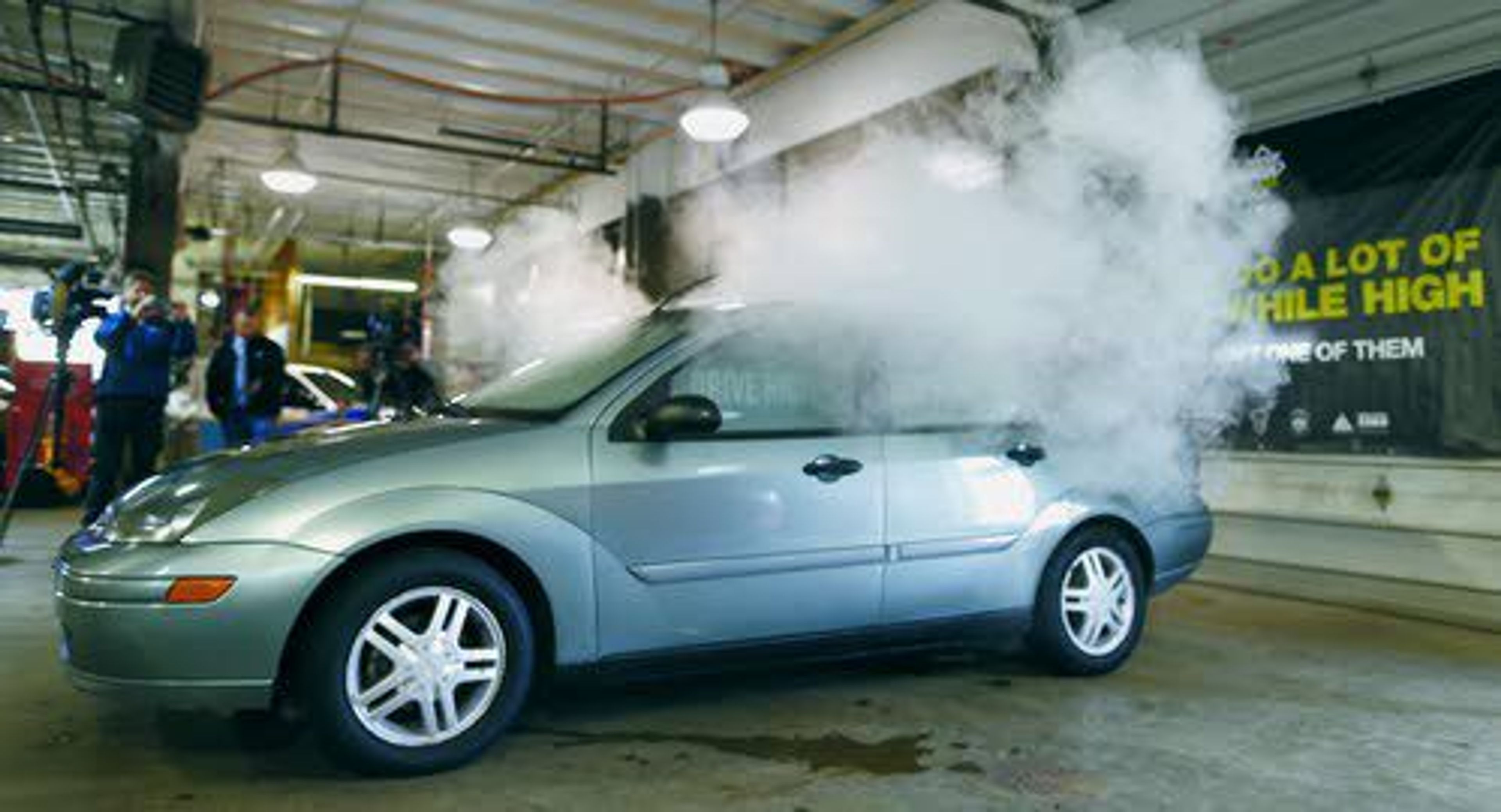 In this 2015 photo, smoke created by water vapor billows out of the windows of a car used by Colorado to fight stoned driving with youth demographics, during a demonstration by the Colorado Department of Transportation in southeast Denver.