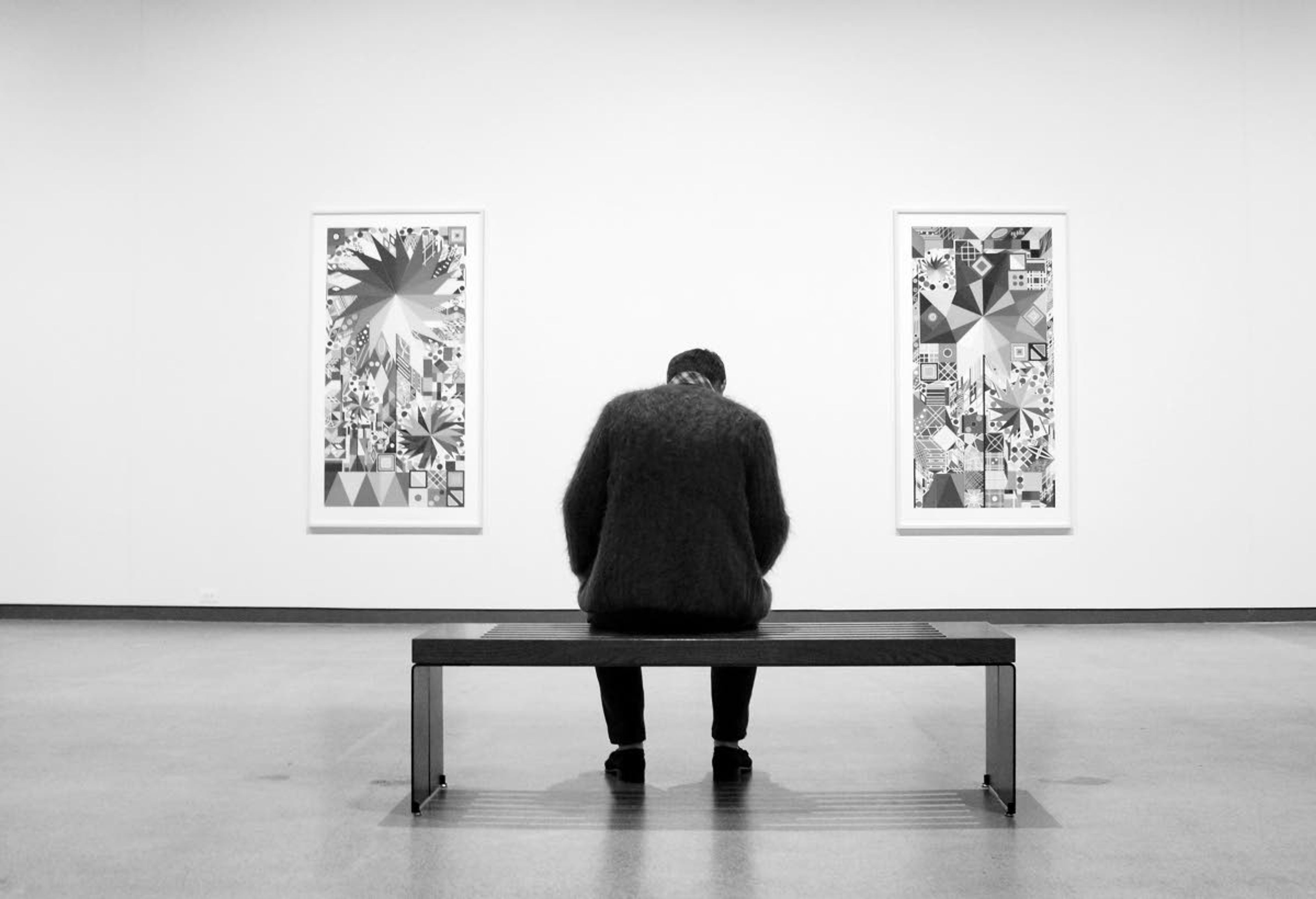 A man contemplates prints by Polly Apfelbaum during a Sept. 4 opening reception for the exhibit at the Jordan Schnitzer Museum of Art at Washington State University.