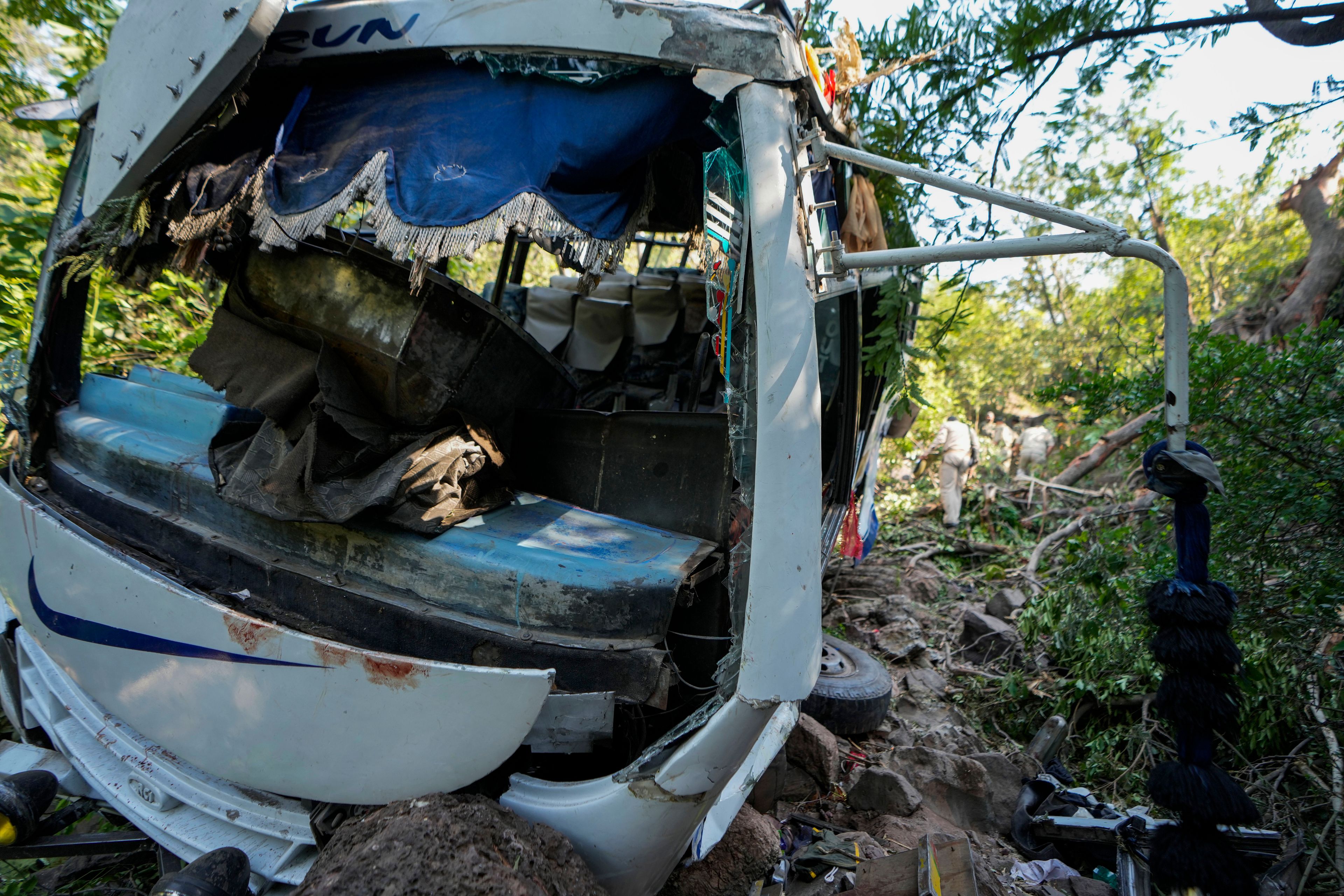 The wreckage of a bus that fell into a deep gorge on Sunday after being fired at by suspected militants in Reasi district, Jammu and Kashmir, Monday, June 10, 2024. The bus was carrying pilgrims to the base camp of the famed Hindu temple Mata Vaishno Devi when it came under attack killing at least nine people.