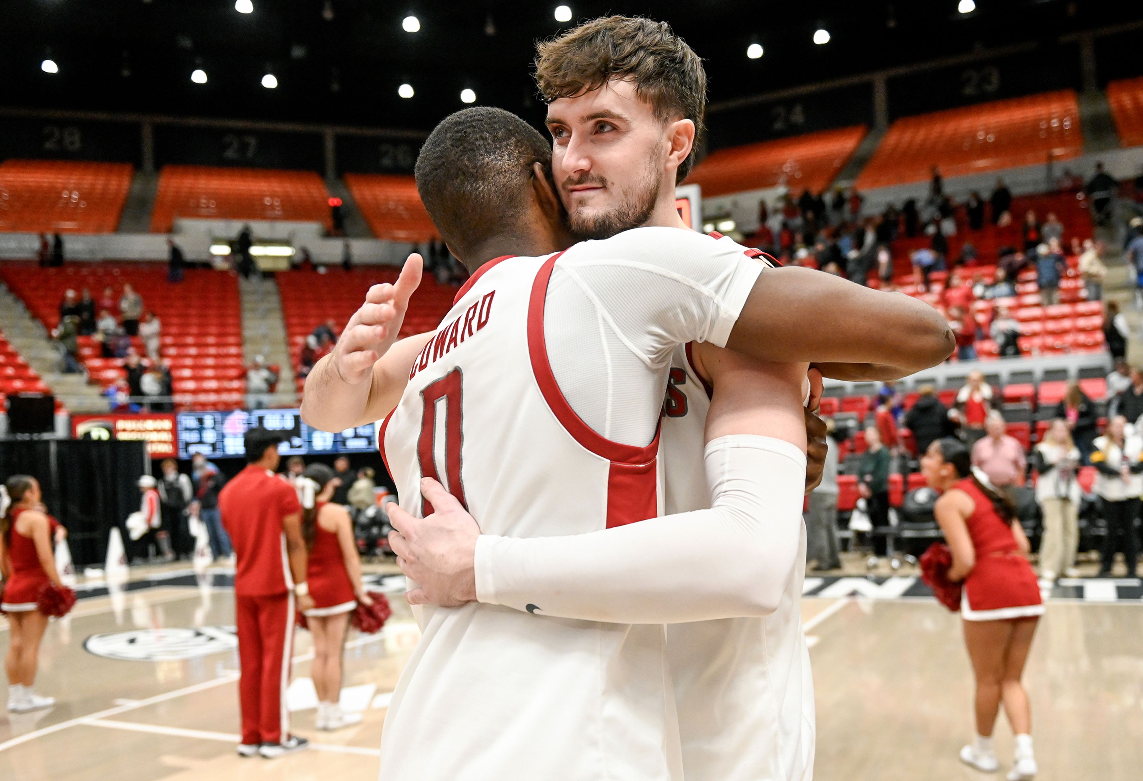 Washington State guard Cedric Coward and Washington State forward Ethan Price embrace after their win over Idaho in the Battle of the Palouse game at Beasley Coliseum in Pullman.