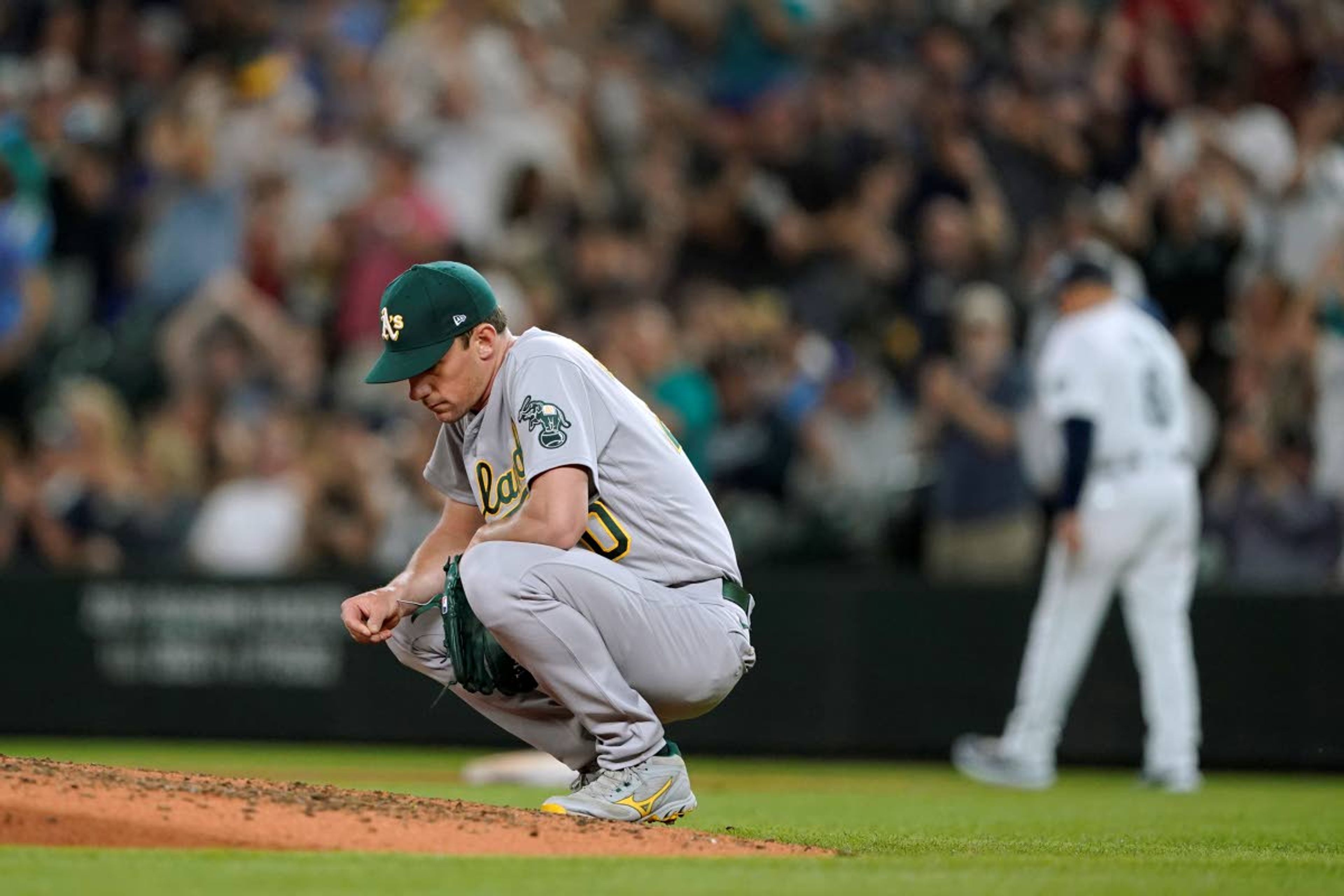 Mariners win on another wild pitch against Athletics