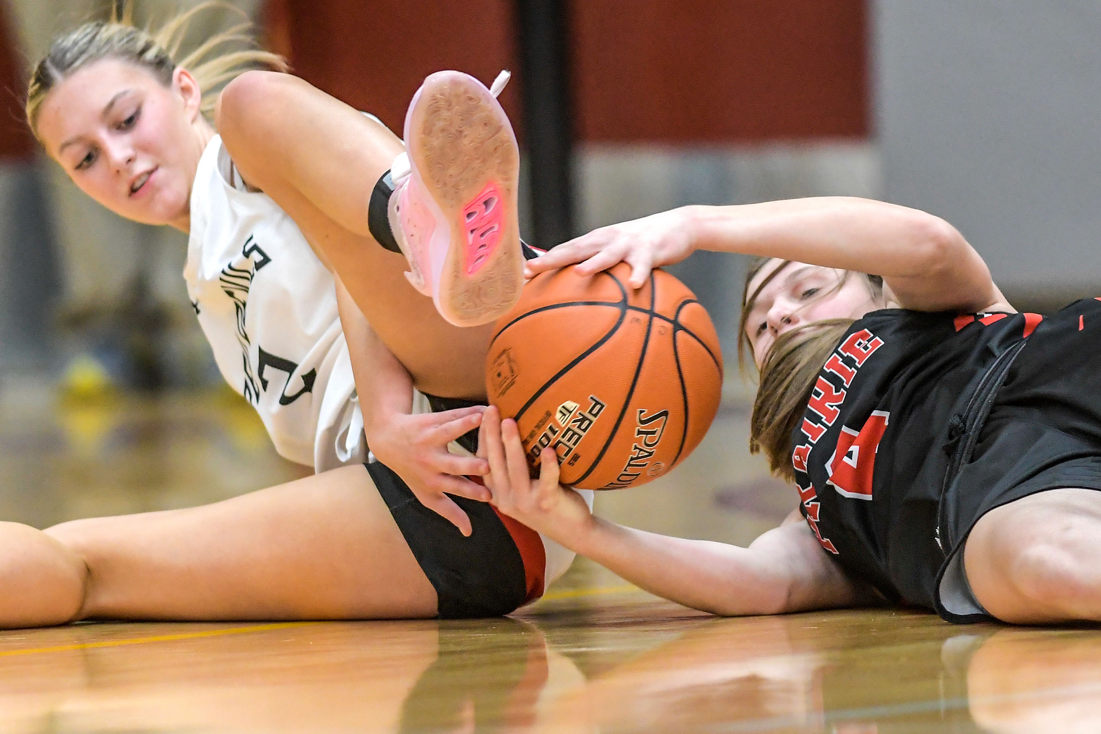 Prairie guard Sydney Shears grabs the ball away from Murtaugh guard Bryleigh Widmier during a quarterfinal game in the girls 1A DI state tournament Thursday at Columbia High School in Nampa.