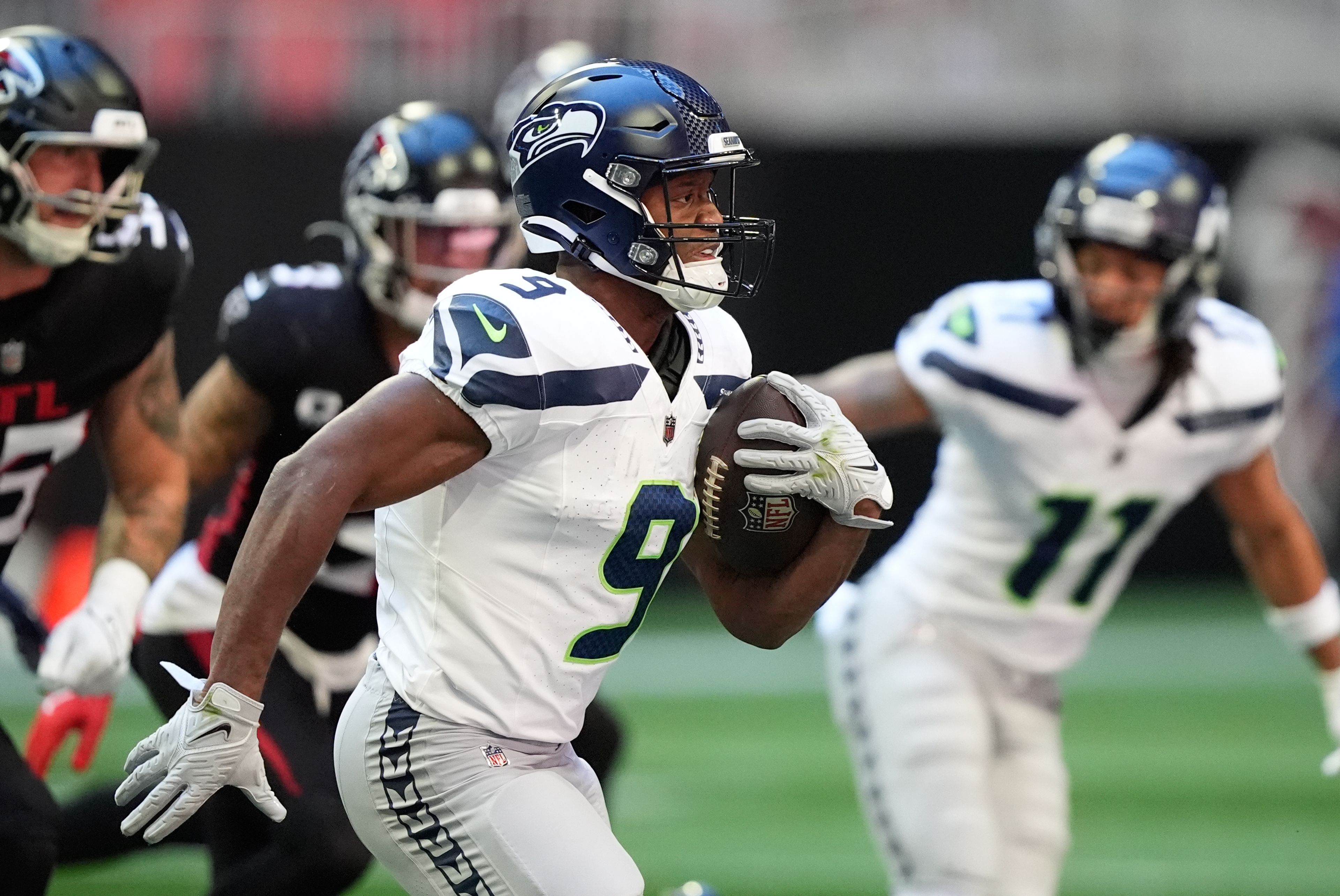 Seattle Seahawks running back Kenneth Walker III (9) runs the ball during the first half of an NFL football game against the Atlanta Falcons, Sunday, Oct. 20, 2024, in Atlanta. (AP Photo/ Brynn Anderson)