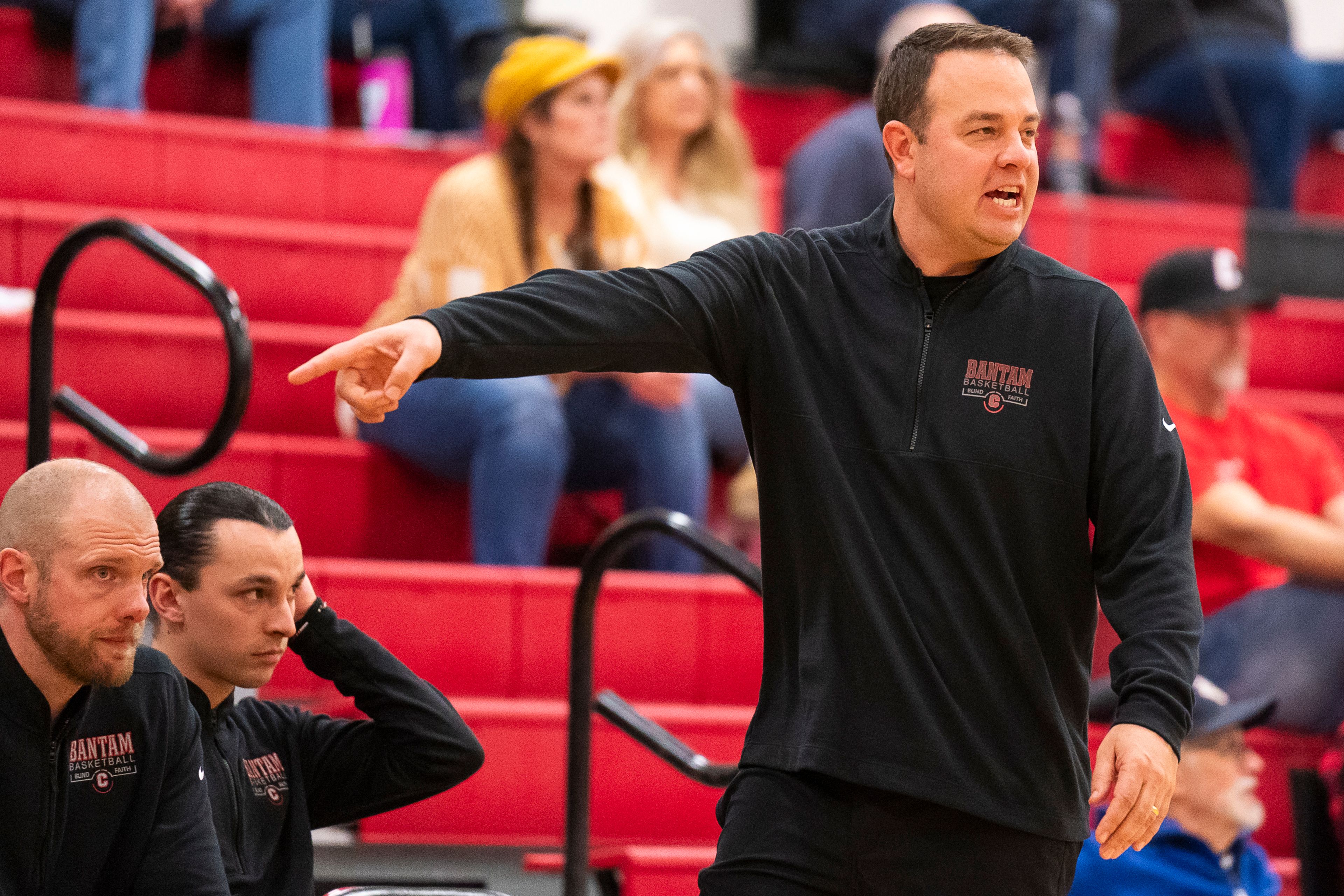 Clarkston boys basketball head coach Justin Jones speaks to his team during their game against West Valley on Tuesday at Clarkston High School.