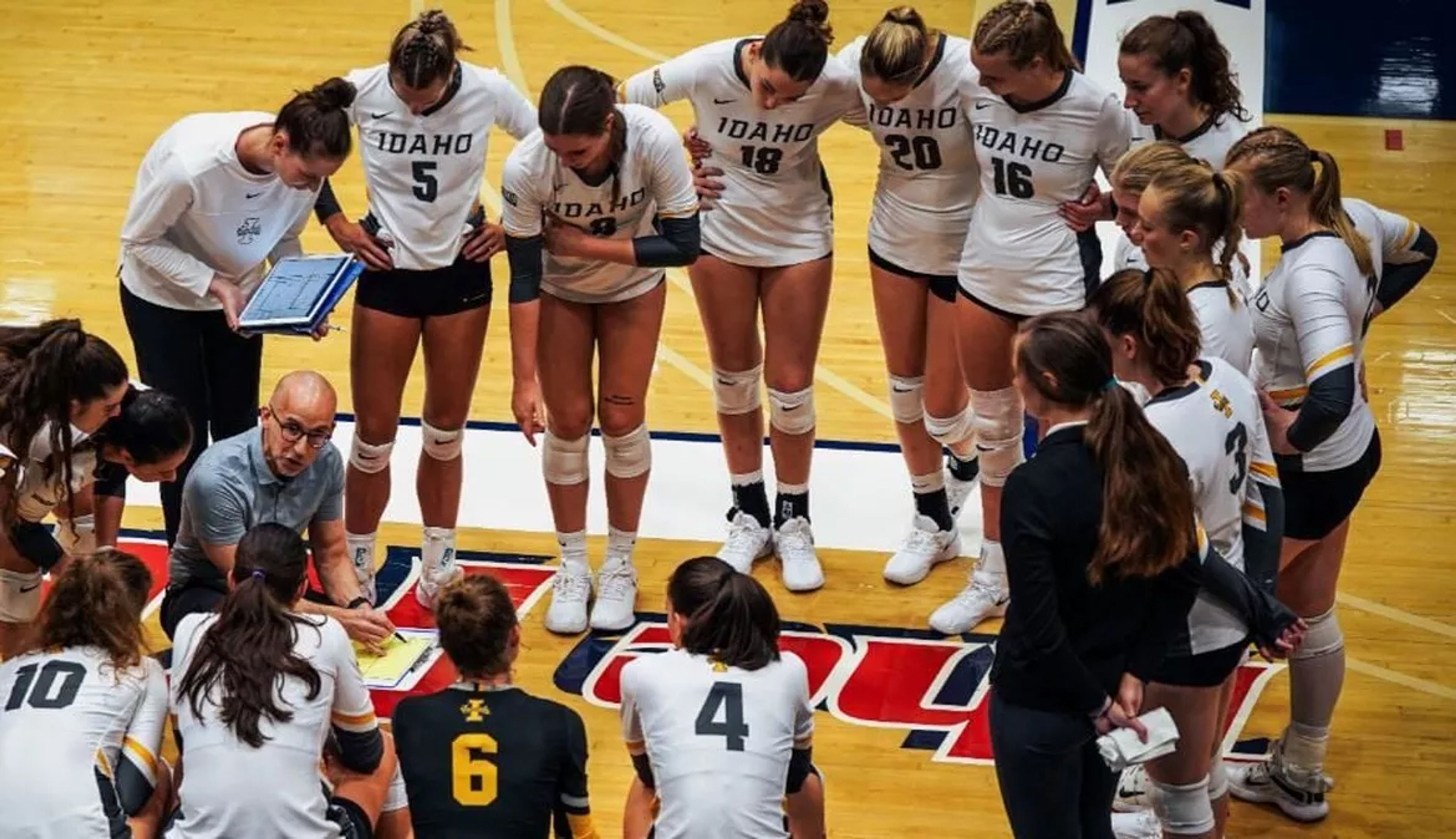 Vandals volleyball coach Chris Gonzalez speaks to his team during a match.