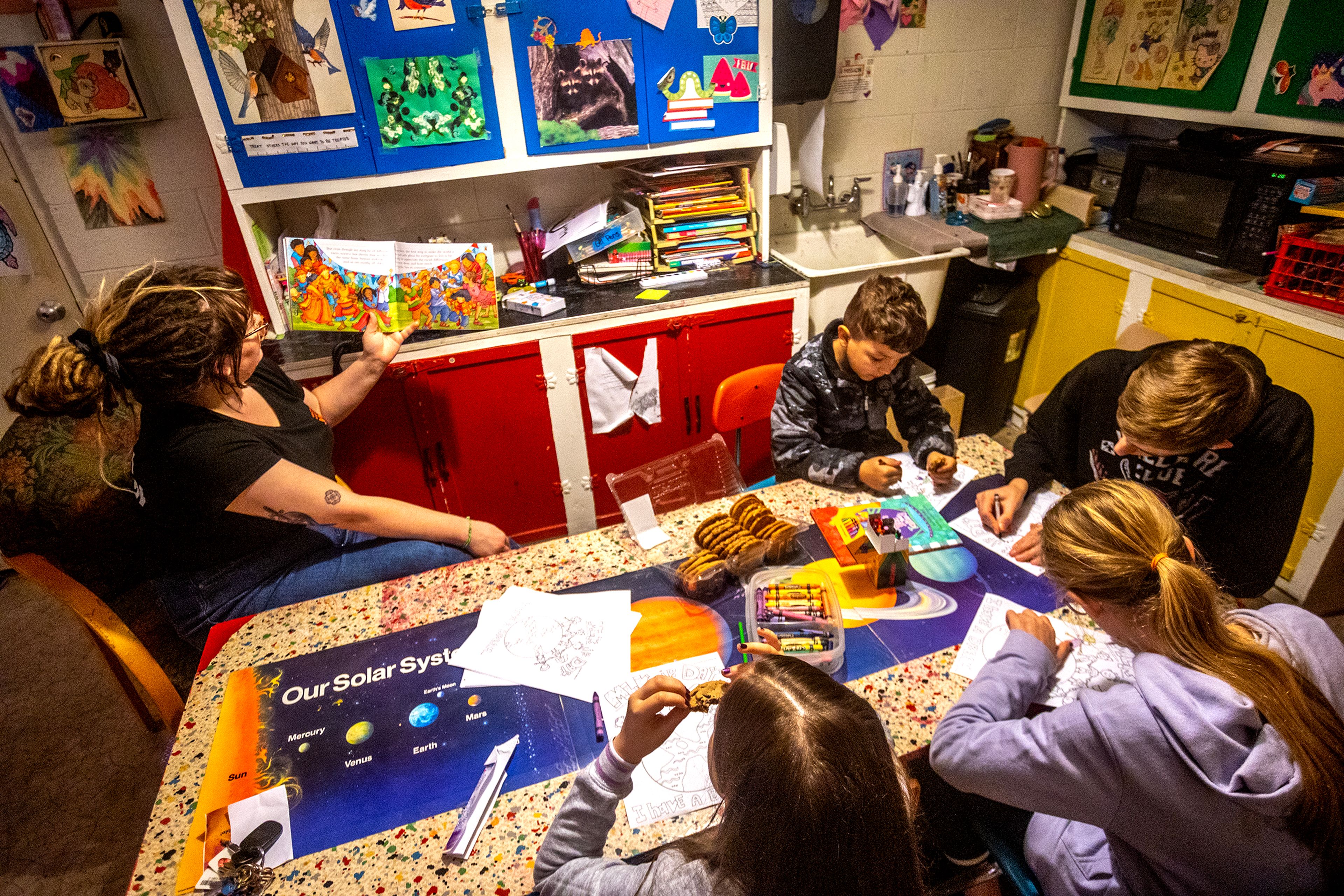 Cori Sanzone, Washington legal advocate for the YWCA, reads the book “The Skin I’m In” to kids during the YWCA Martin Luther King Jr. Day event Monday in Lewiston.