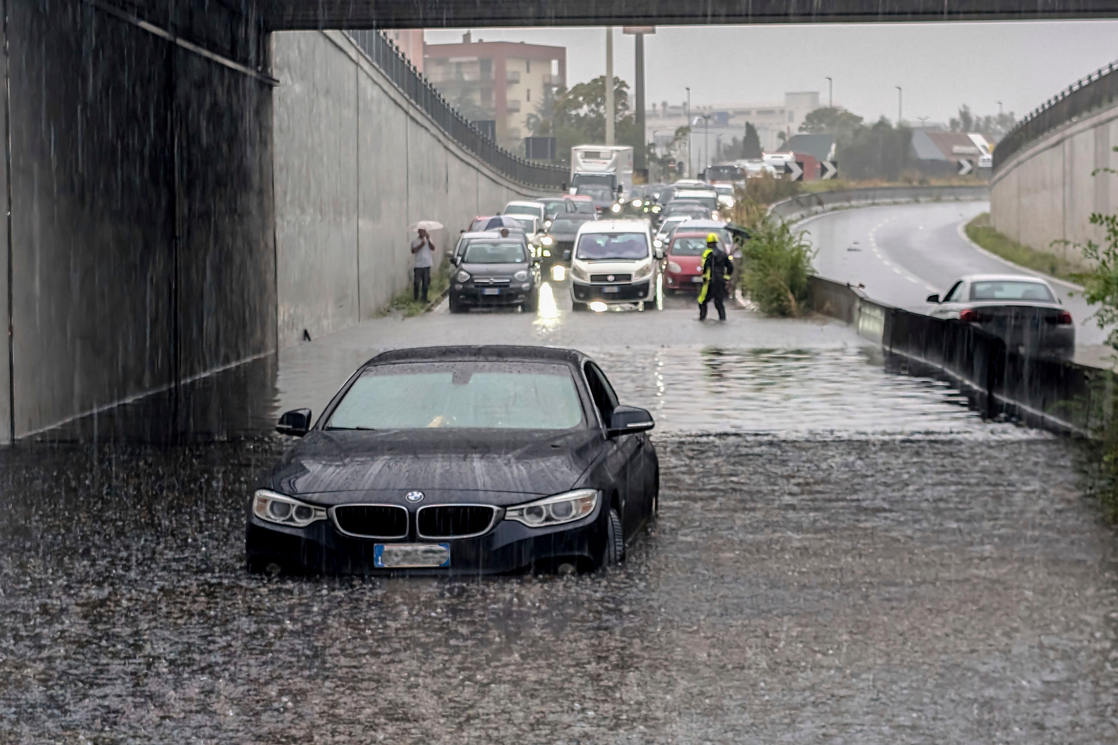 Cars are blocked in flooded streets in Milan, northern Italy, Thursday, Sept. 5, 2024. Lombardy and Veneto have been hit by widespread flooding, causing damage and disruption in the city of Milan, where the local Seveso and Lambro rivers overflowed.