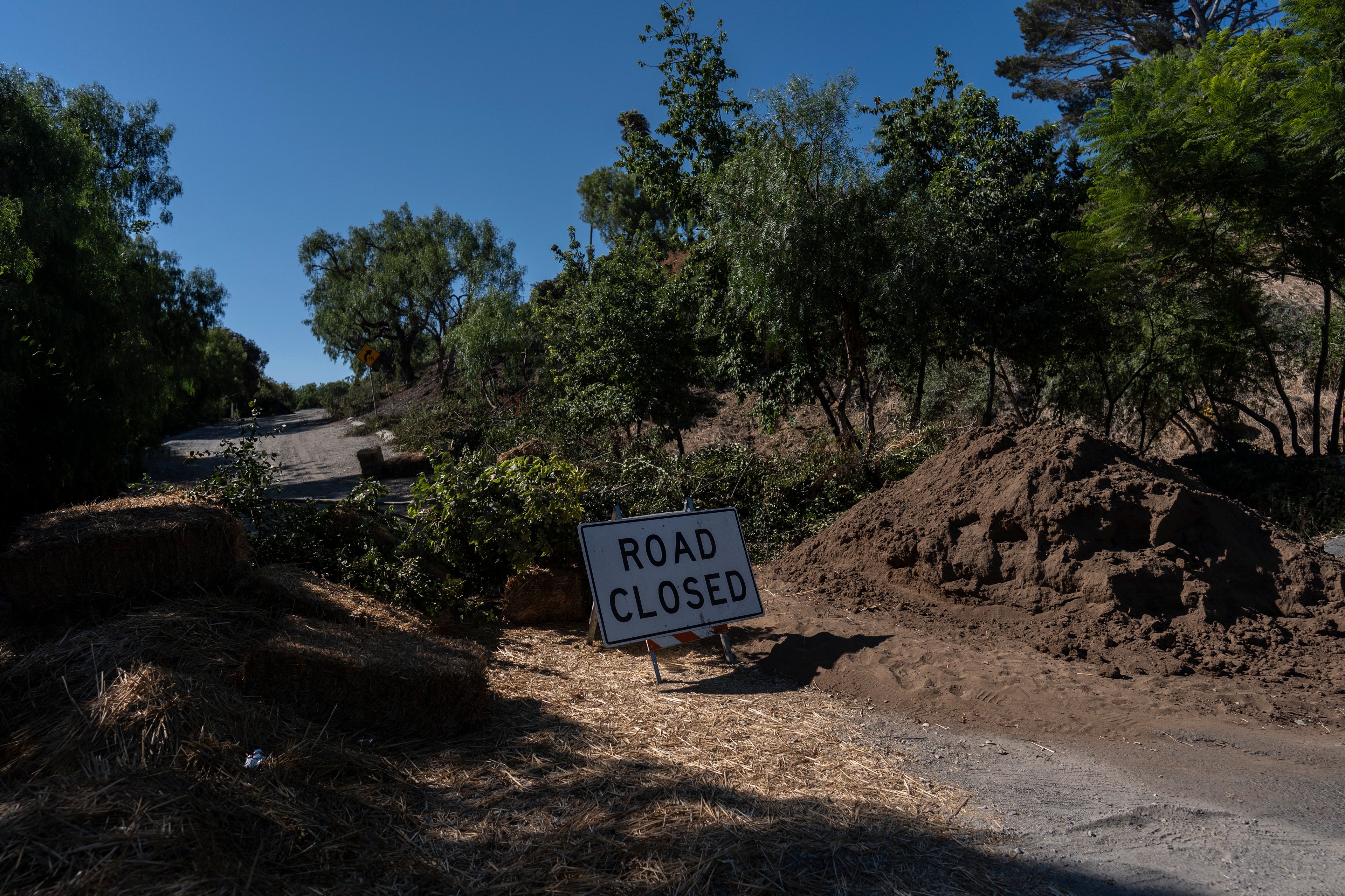 A road closure sign stands in a neighborhood affected by ongoing landslides in Rancho Palos Verdes, Calif., Tuesday, Sept. 3, 2024.