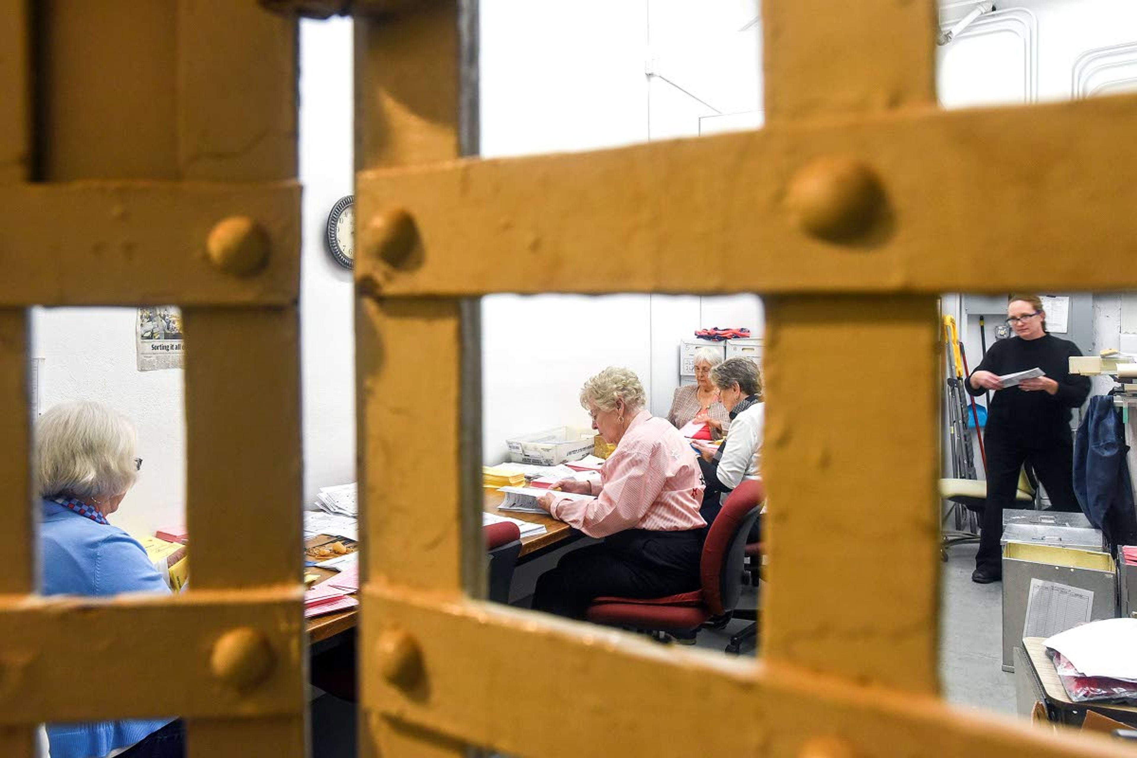 Asotin County election workers sort through ballots Tuesday afternoon in the old jail at the Asotin County Courthouse.