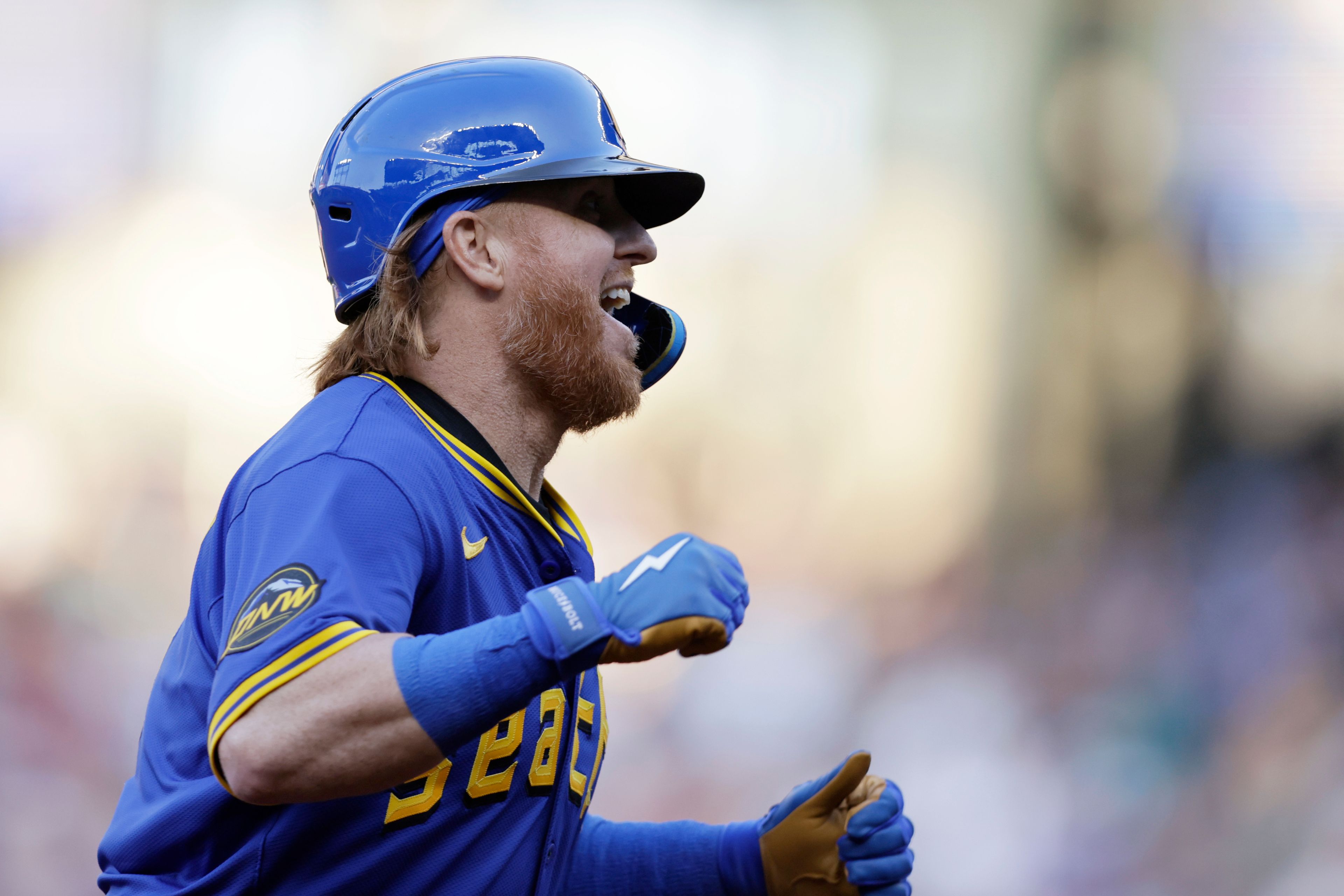 Seattle Mariners' Justin Turner celebrates as he rounds the bases on his grand slam off Philadelphia Phillies starting pitcher Tyler Phillips during the second inning in a baseball game, Friday, Aug. 2, 2024, in Seattle. (AP Photo/John Froschauer)