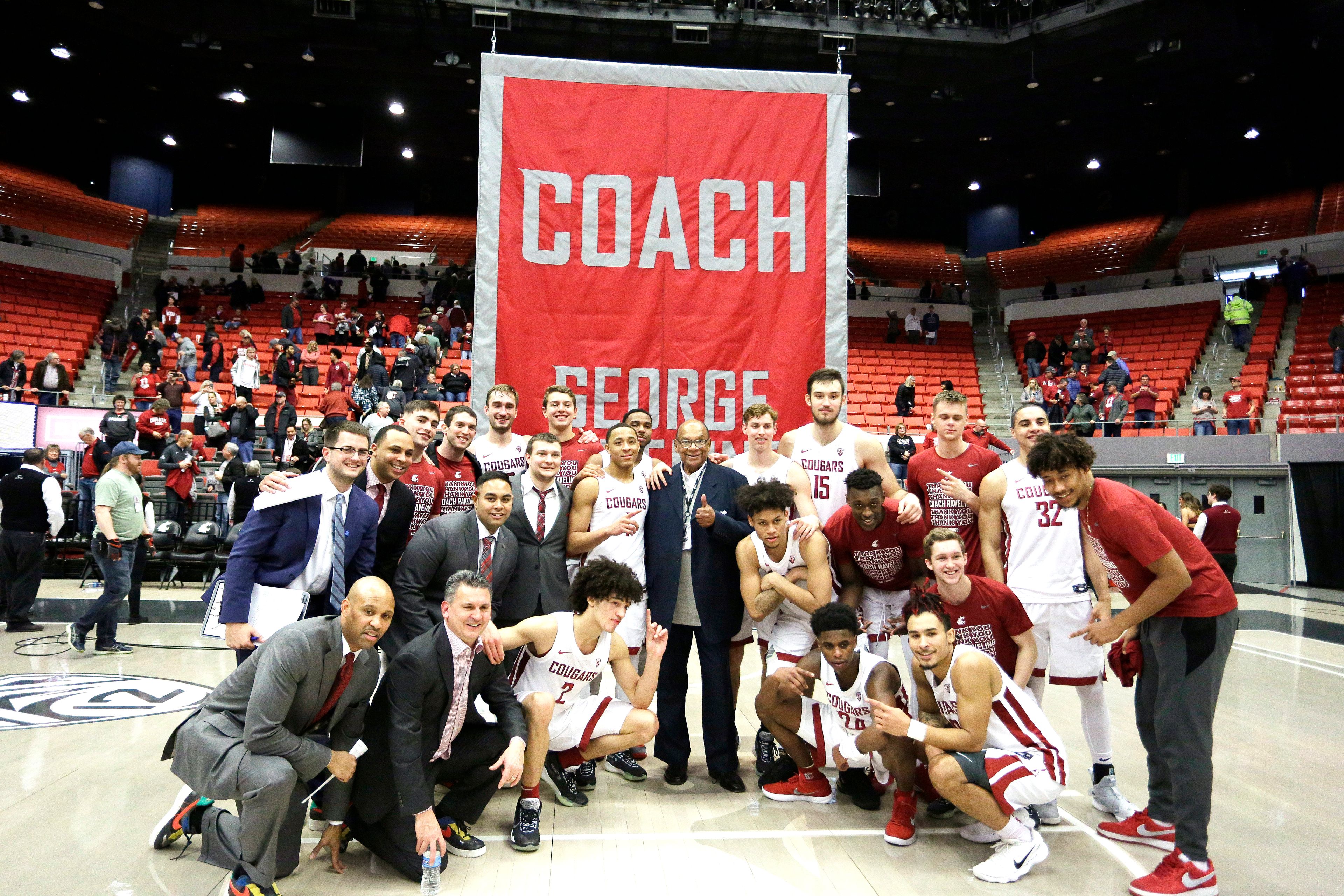 Former Washington State basketball head coach George Raveling, center, poses for a photograph with the Cougars after an NCAA college basketball game between Washington State and Washington in Pullman, Wash., Sunday, Feb. 9, 2020. (AP Photo/Young Kwak)