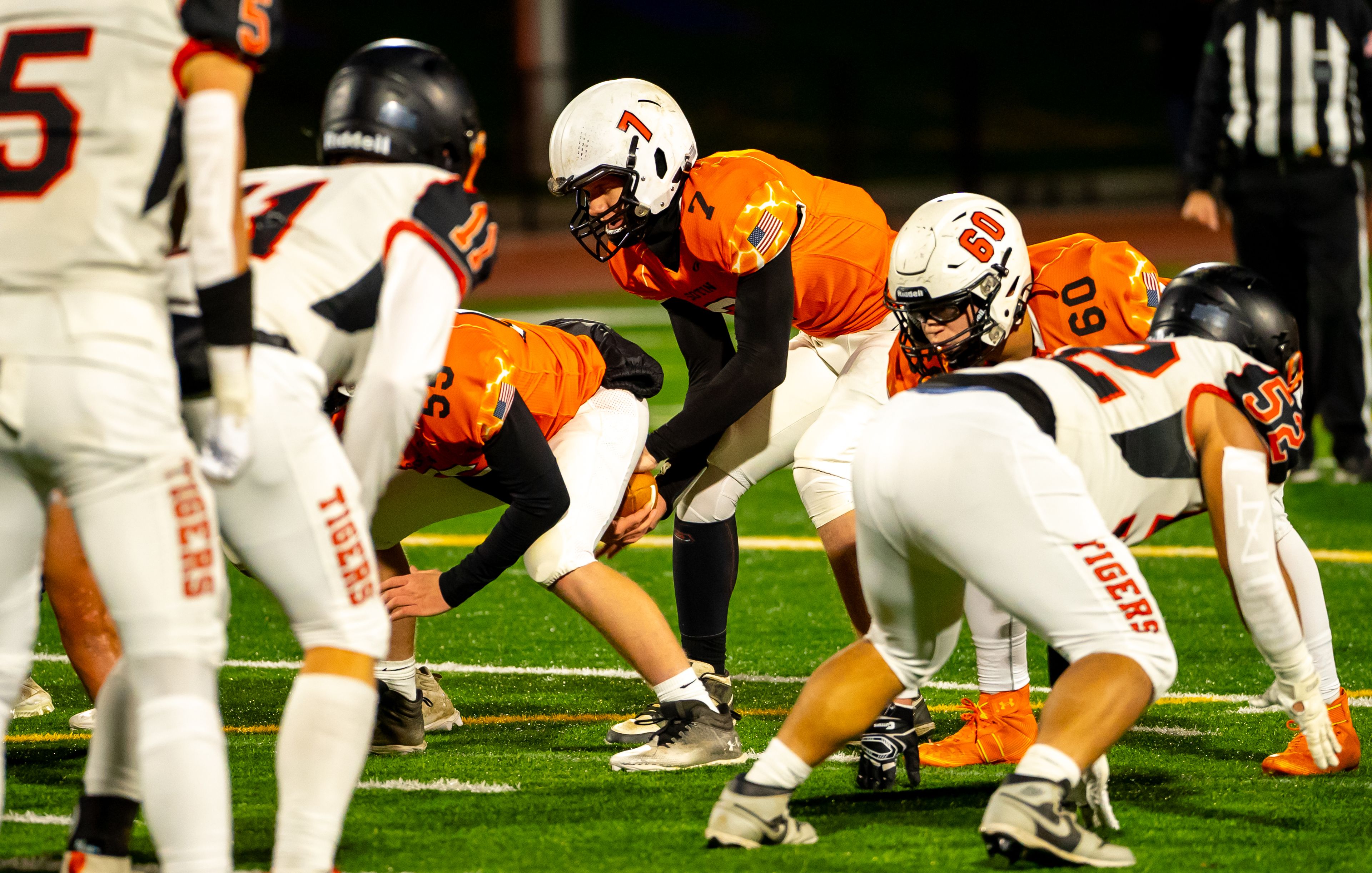 Asotin quarterback Cody Ells, center, takes a snap during a semifinal game against Napavine in the Washington 2B state tournament Saturday in Richland.