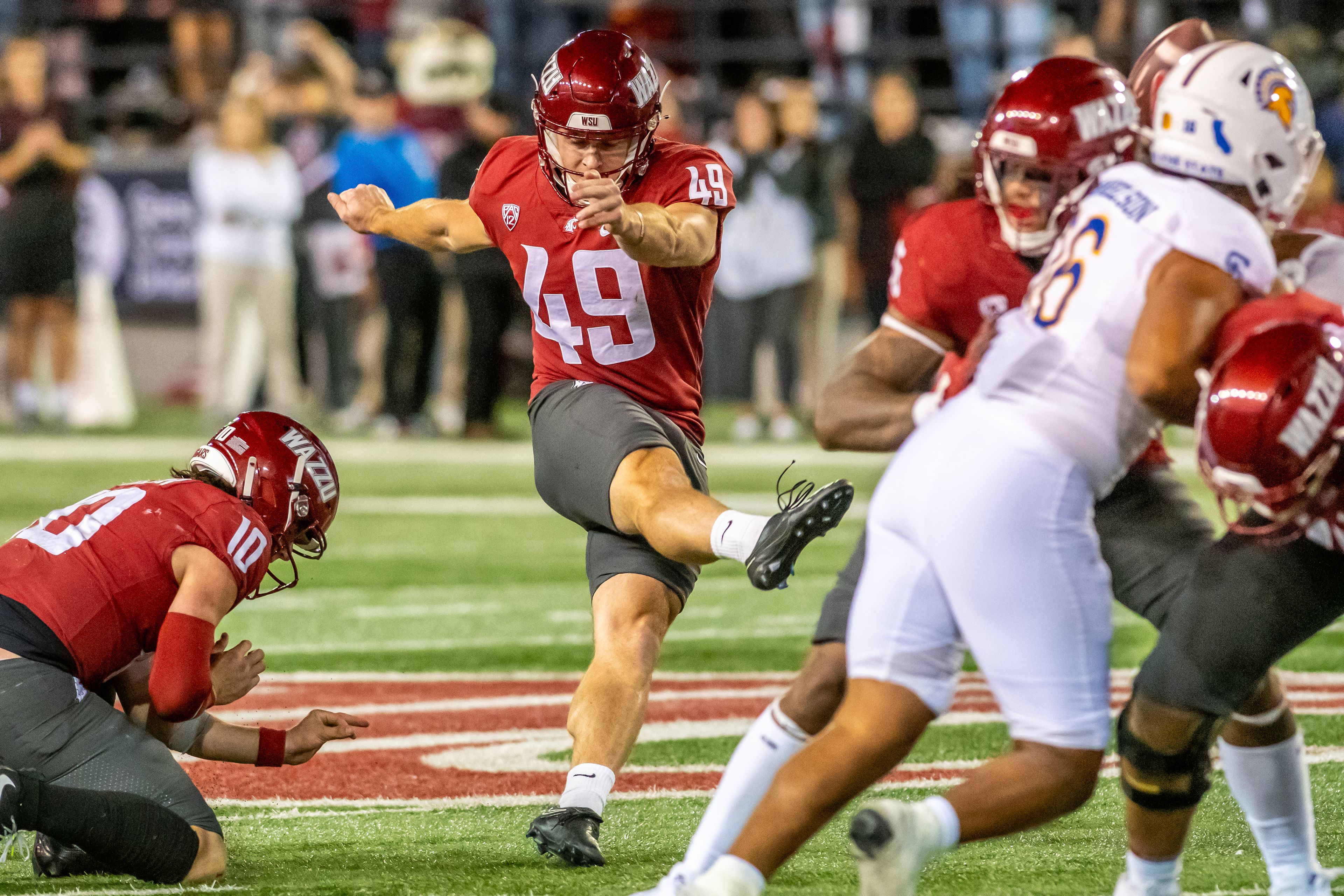 Washington State place kicker Dean Janikowski kicks a field goal to tie the game against San Jose State during a quarter of a game Friday at Gesa Field in Pullman.