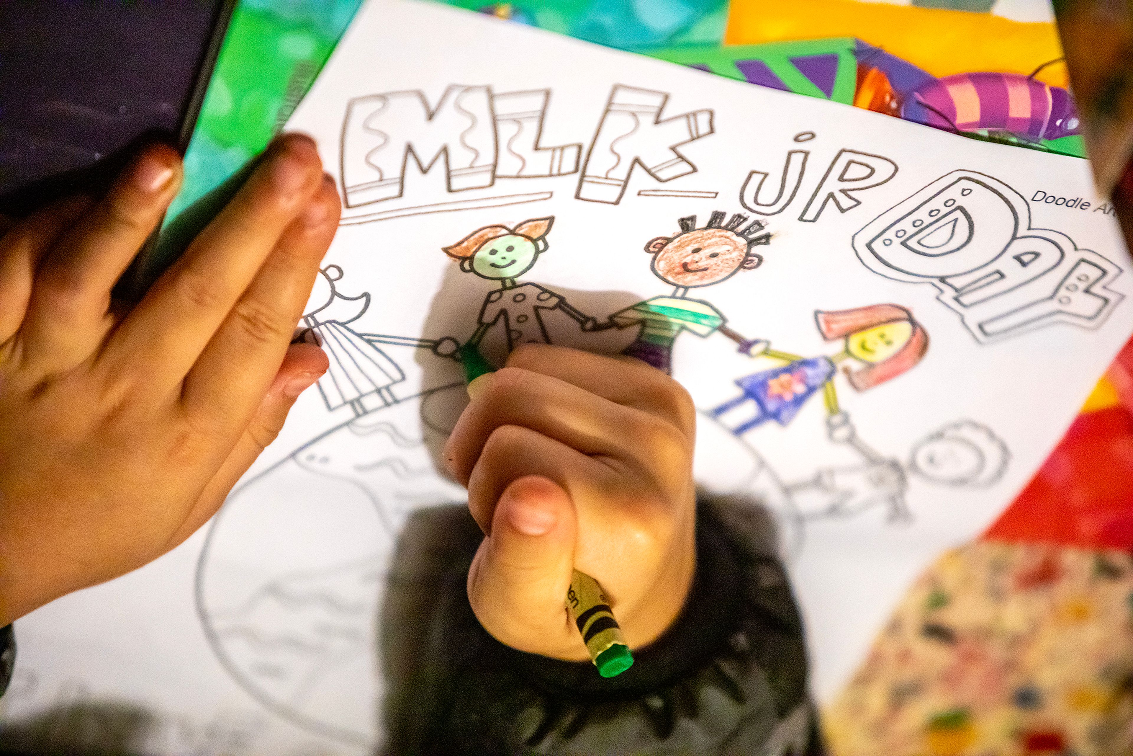 A child colors a Martin Luther King Jr. Day picture during the YWCA Martin Luther King Jr. Day event Monday in Lewiston.