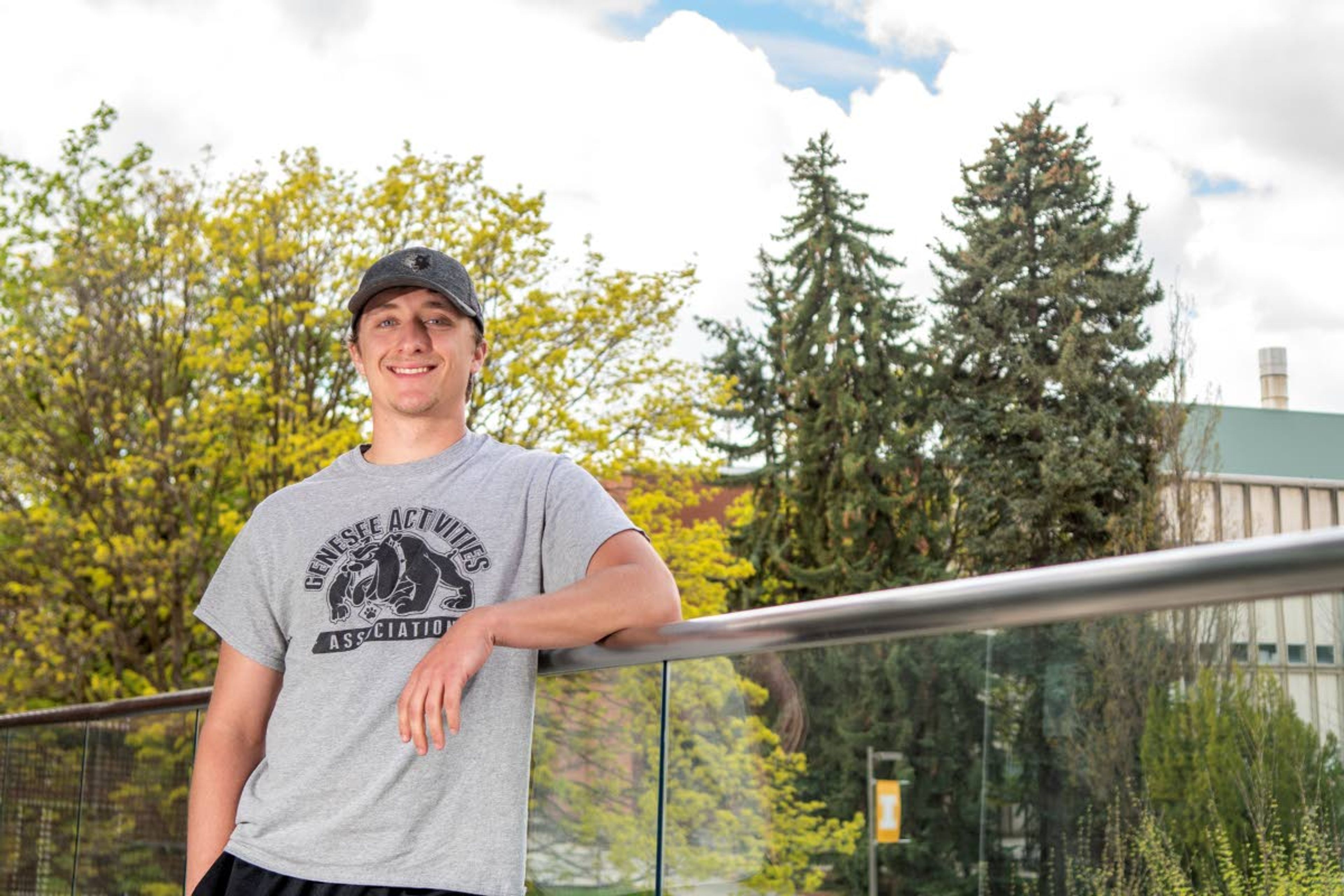 Garrett Borth, who will graduate from University of Idaho with a bachelor’s degree in mechanical engineering this weekend, poses for a photo on the second-floor balcony of the Integrated Research and Innovation Center.