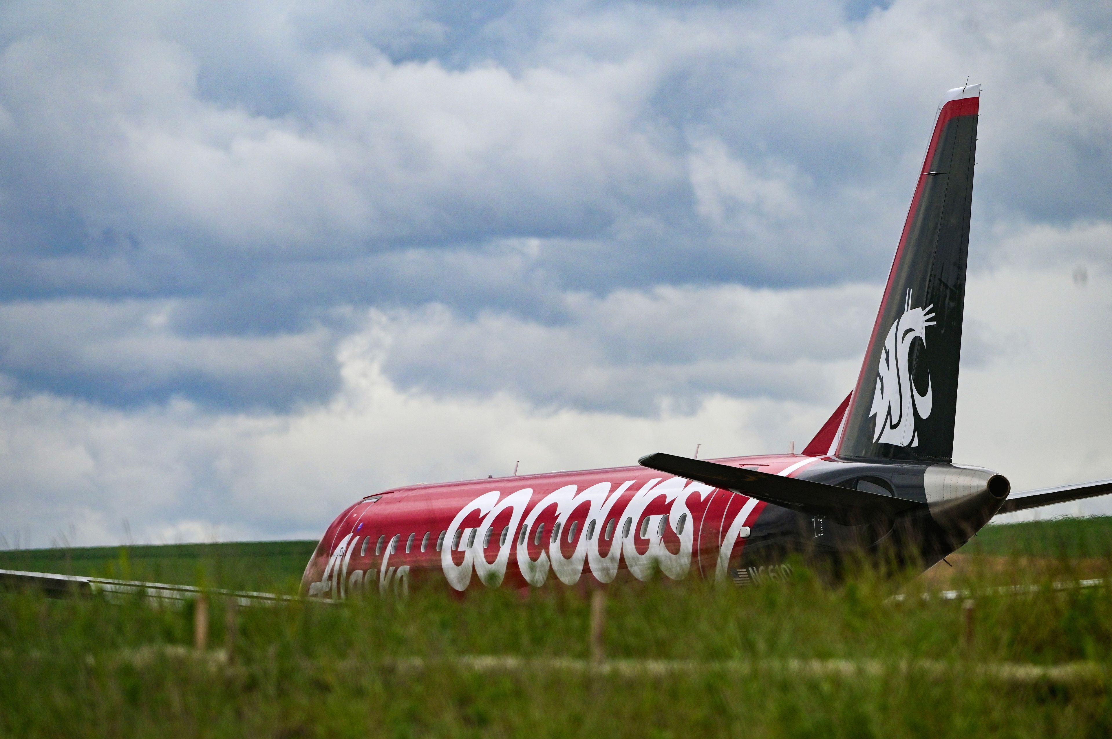 The “Go Cougs” jet with Alaska Airlines prepares for departure from the new Pullman-Moscow Regional Airport terminal on Wednesday.