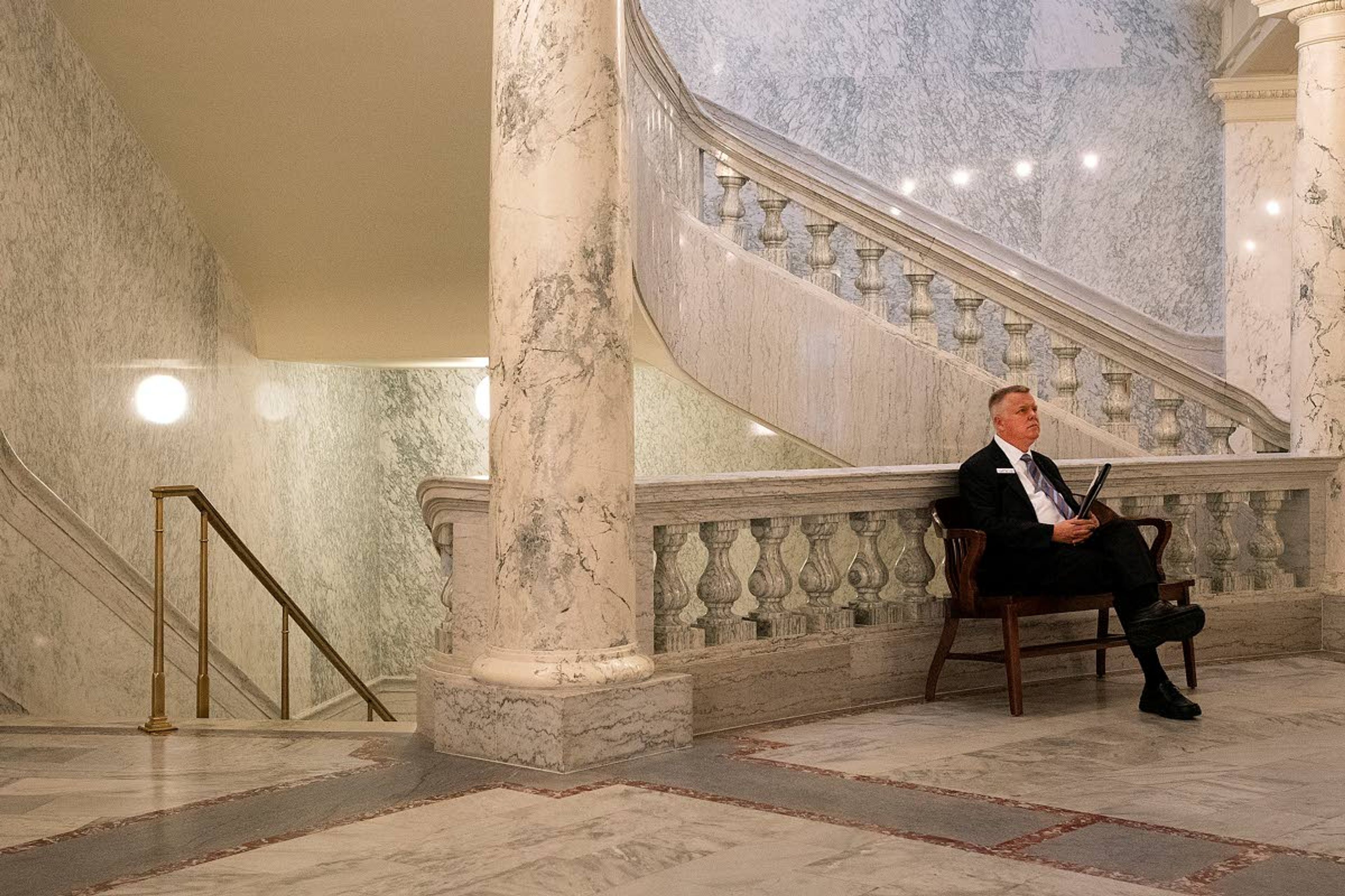 Sen. David Nelson, D-Moscow, sits on a bench in the Capitol before a bill signing with Gov. Brad Little in February. Nelson is one of only a few Democrats among the new crop of legislators in Boise.