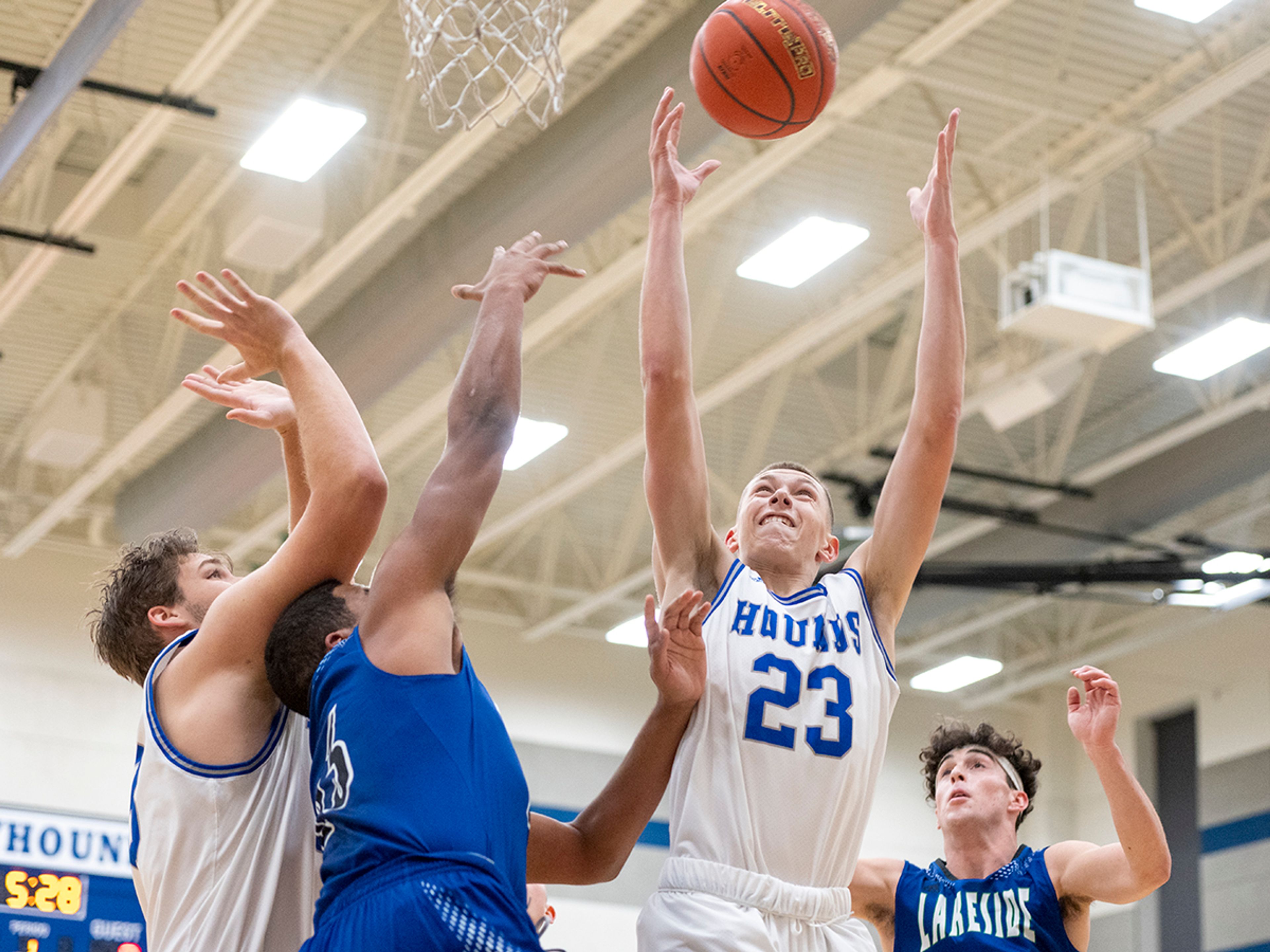 Pullman forward Dane Sykes, right, grabs a rebound during Friday's nonleague game against Lakeside.