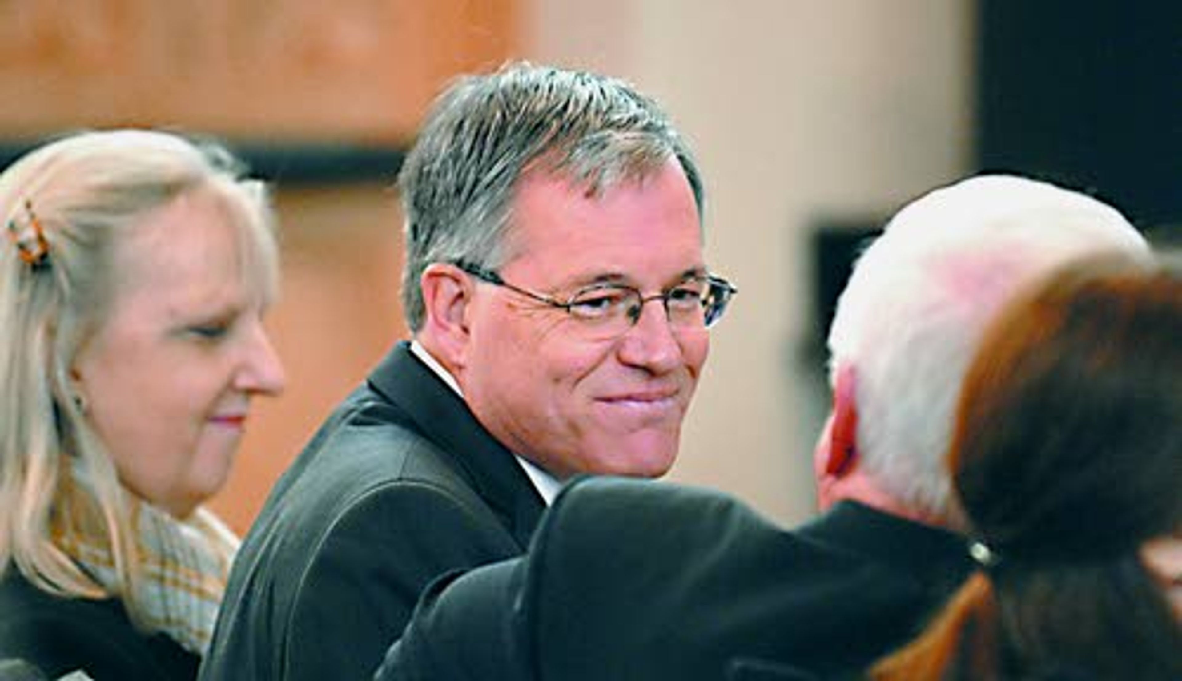 Just officially named as the 18th University of Idaho president by the State Board of Education, Chuck Staben is congratulated by interim President Don Burnett Monday morning at Moscow. The president was accompanied by his wife, Mary Beth Staben.