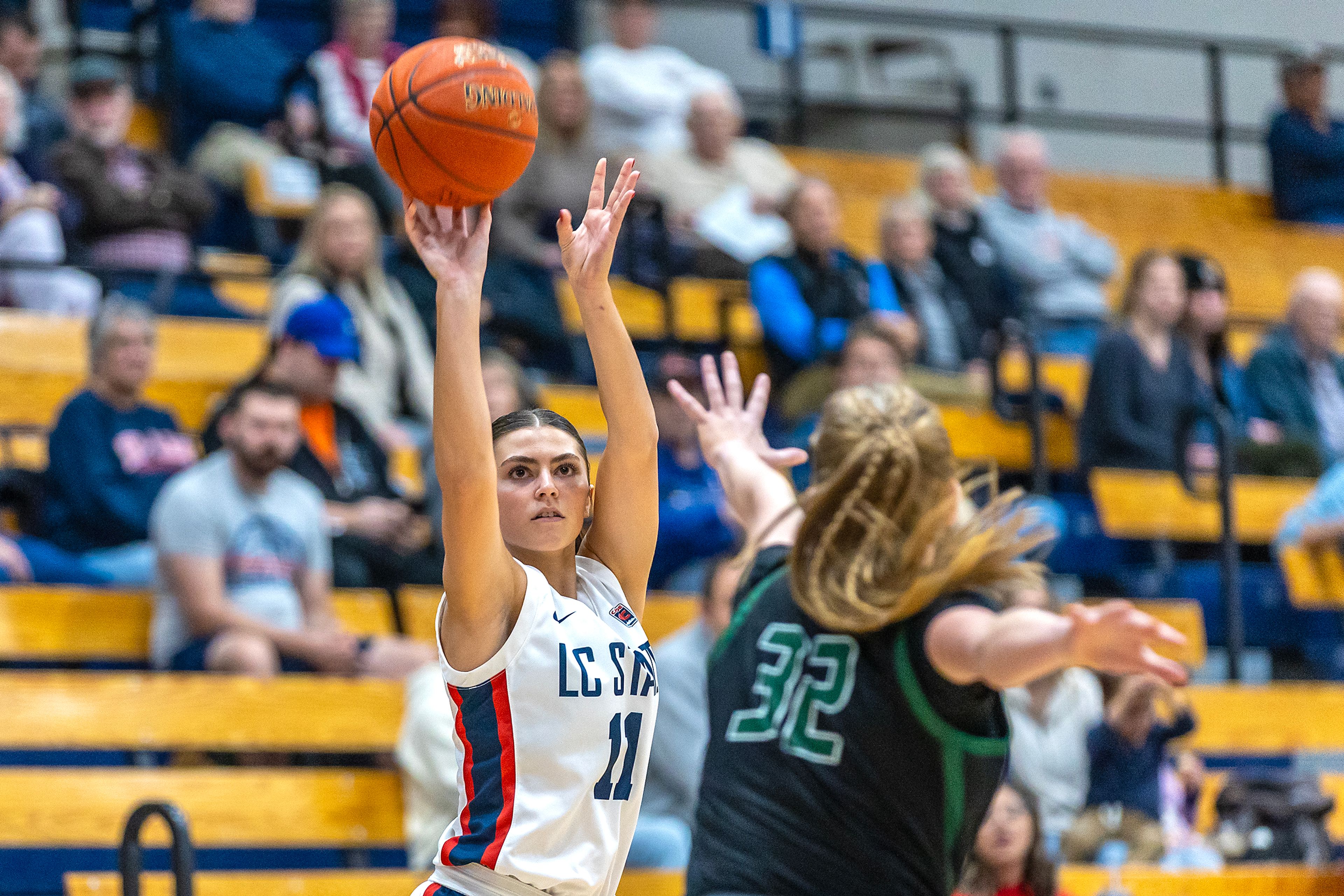 Lewis-Clark State guard Tatum Brager shoots the ball as Walla Walla center Sidney Folkenberg guards her during a quarter of a Cascade Conference game Tuesday at Lewis-Clark State College in Lewiston.