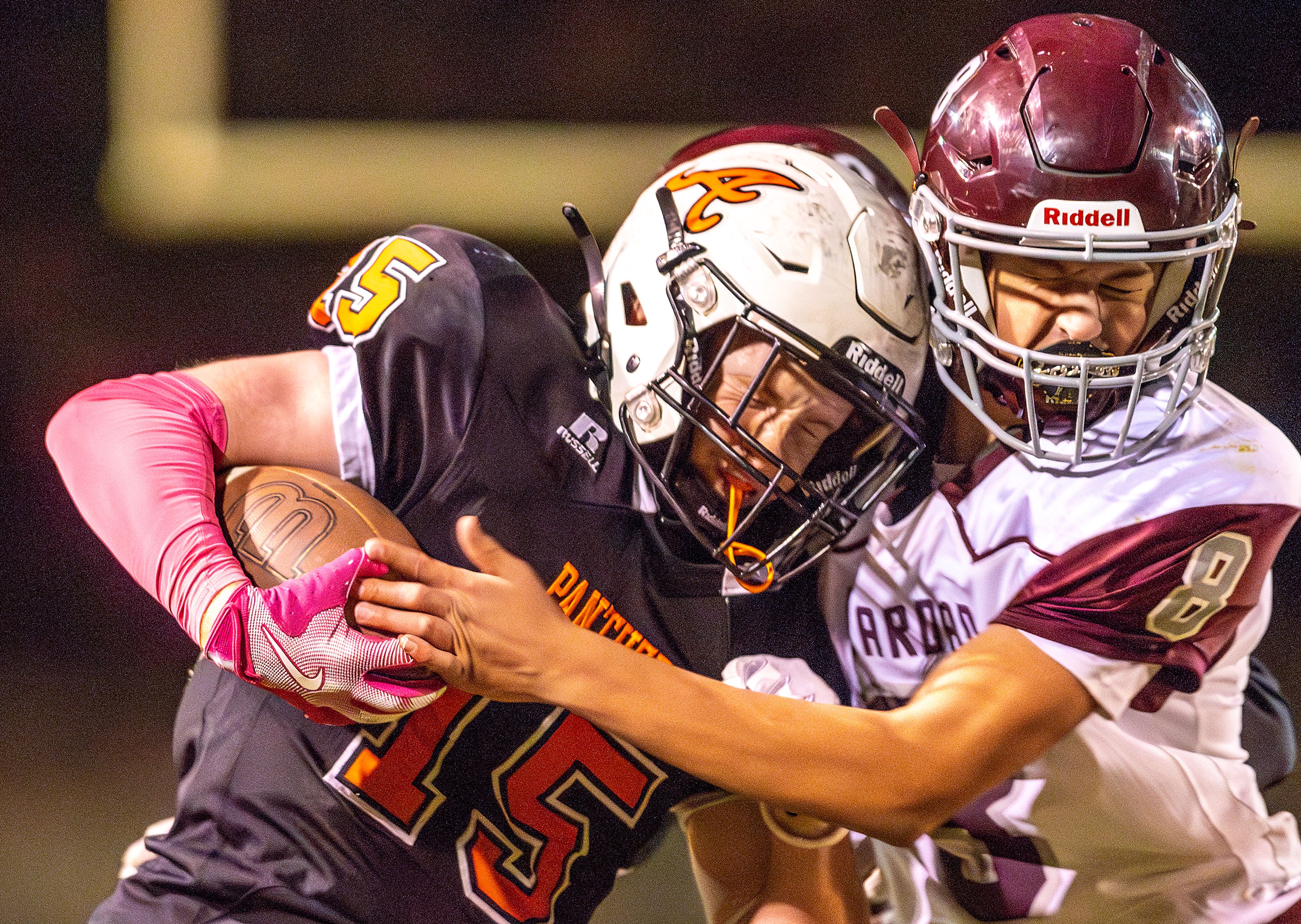 Asotin running back Carson Reedy runs the ball as Reardan�s Colton Summers hits him during a Northeast 2B League game Friday in Asotin.,