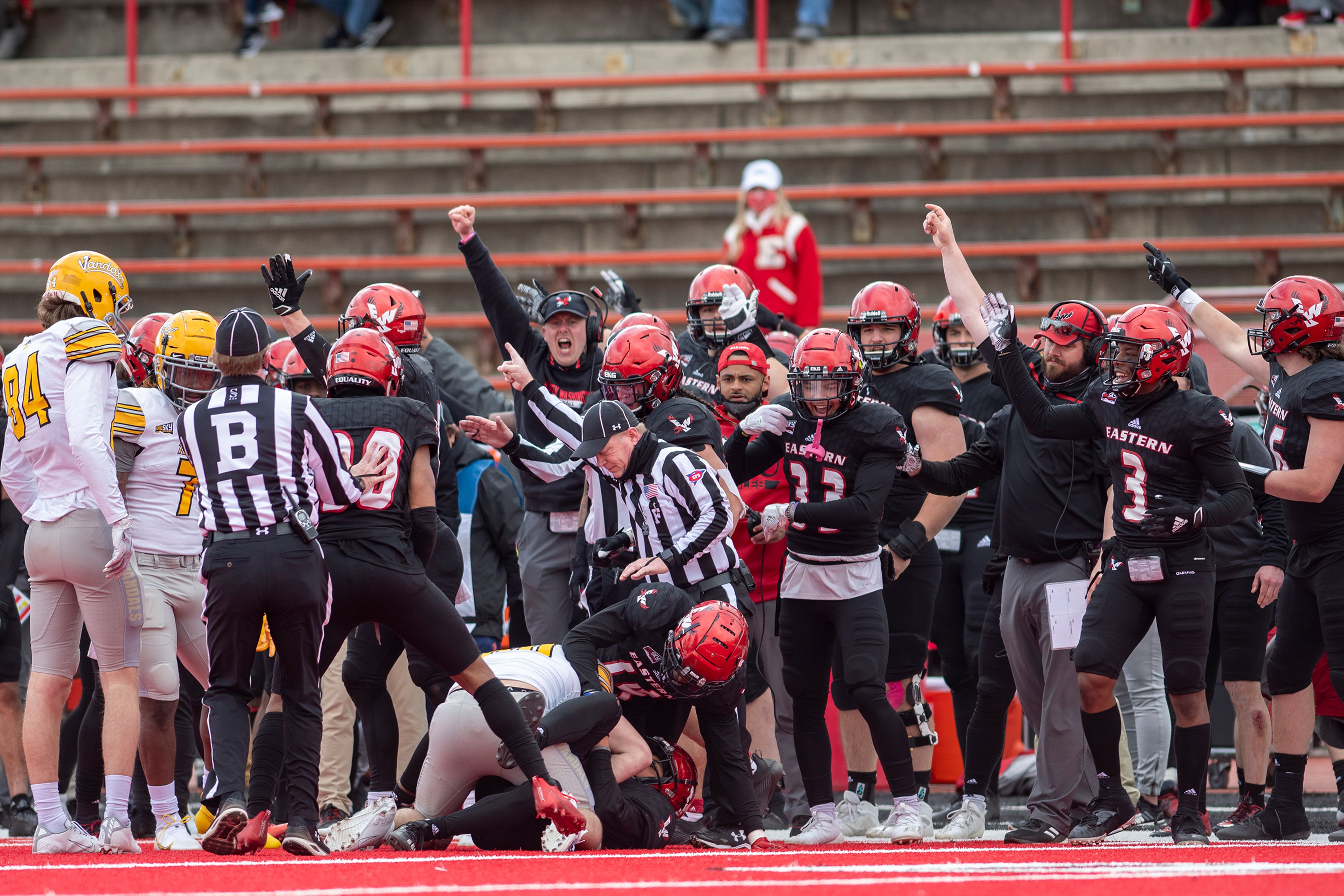 Eastern Washington players celebrate after an interception is confirmed during the fourth quarter of a Big Sky Conference matchup at Roos Field on Saturday afternoon. Eastern Washington defeated Idaho 38-31.