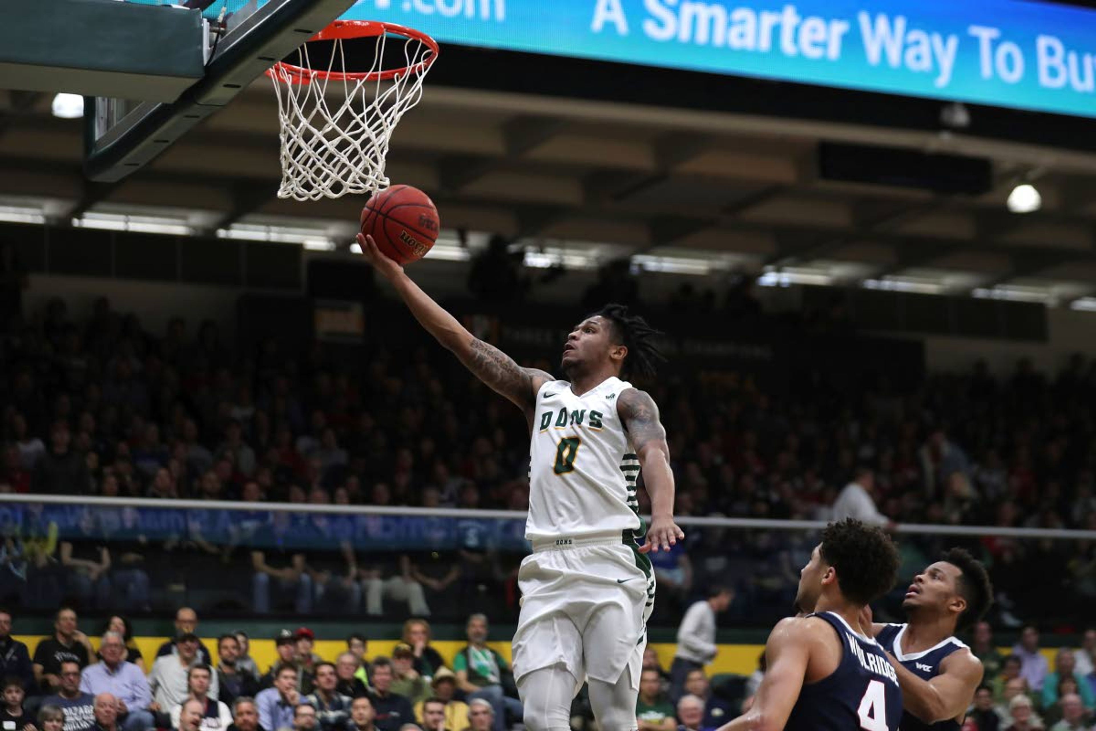 San Francisco guard Khalil Shabazz (0) shoots against Gonzaga guard Ryan Woolridge (4) during the first half of an NCAA college basketball game in San Francisco, Saturday, Feb. 1, 2020. (AP Photo/Jed Jacobsohn)