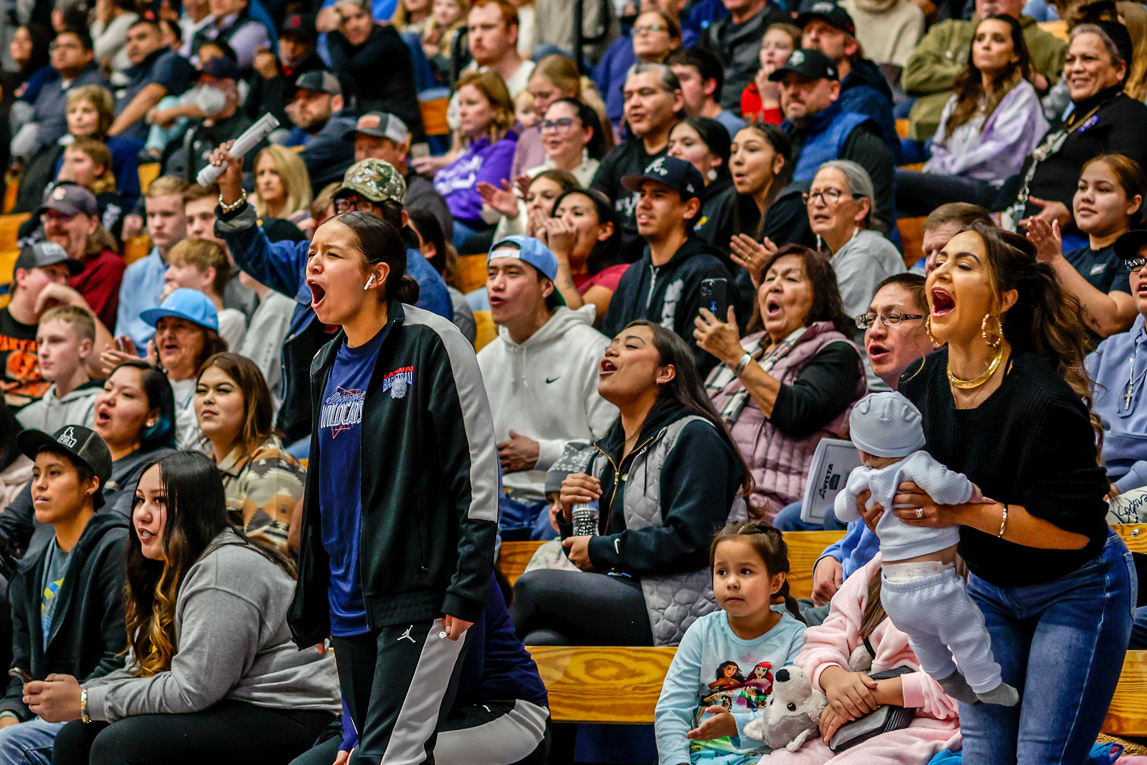 Lapwai fans cheer after a block during the Avista Holiday Tournament on Wednesday against Lewiston.