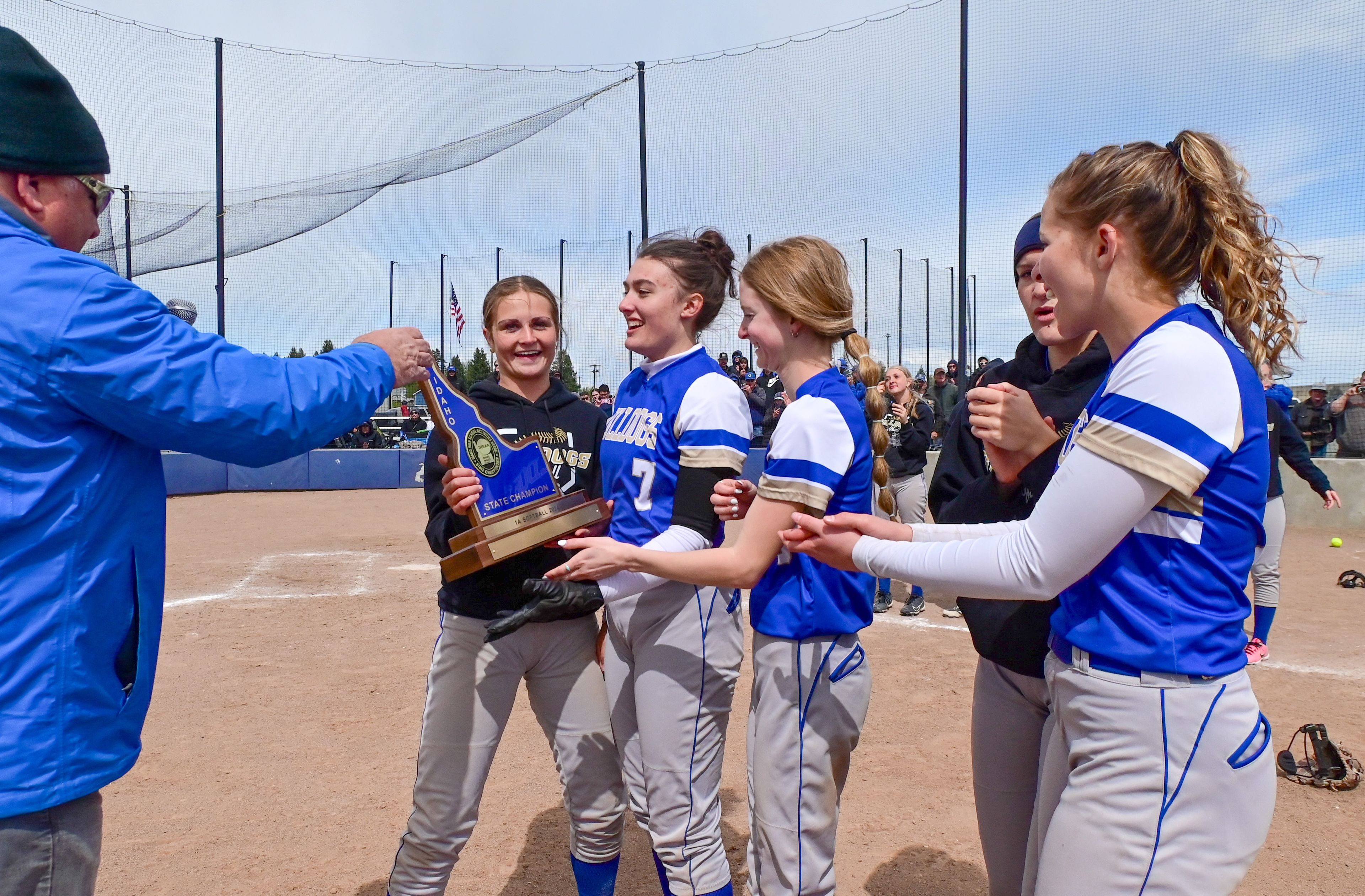 Genesee players are given a trophy after winning the Idaho Class 1A state championship game against Kendrick on Friday in Genesee.